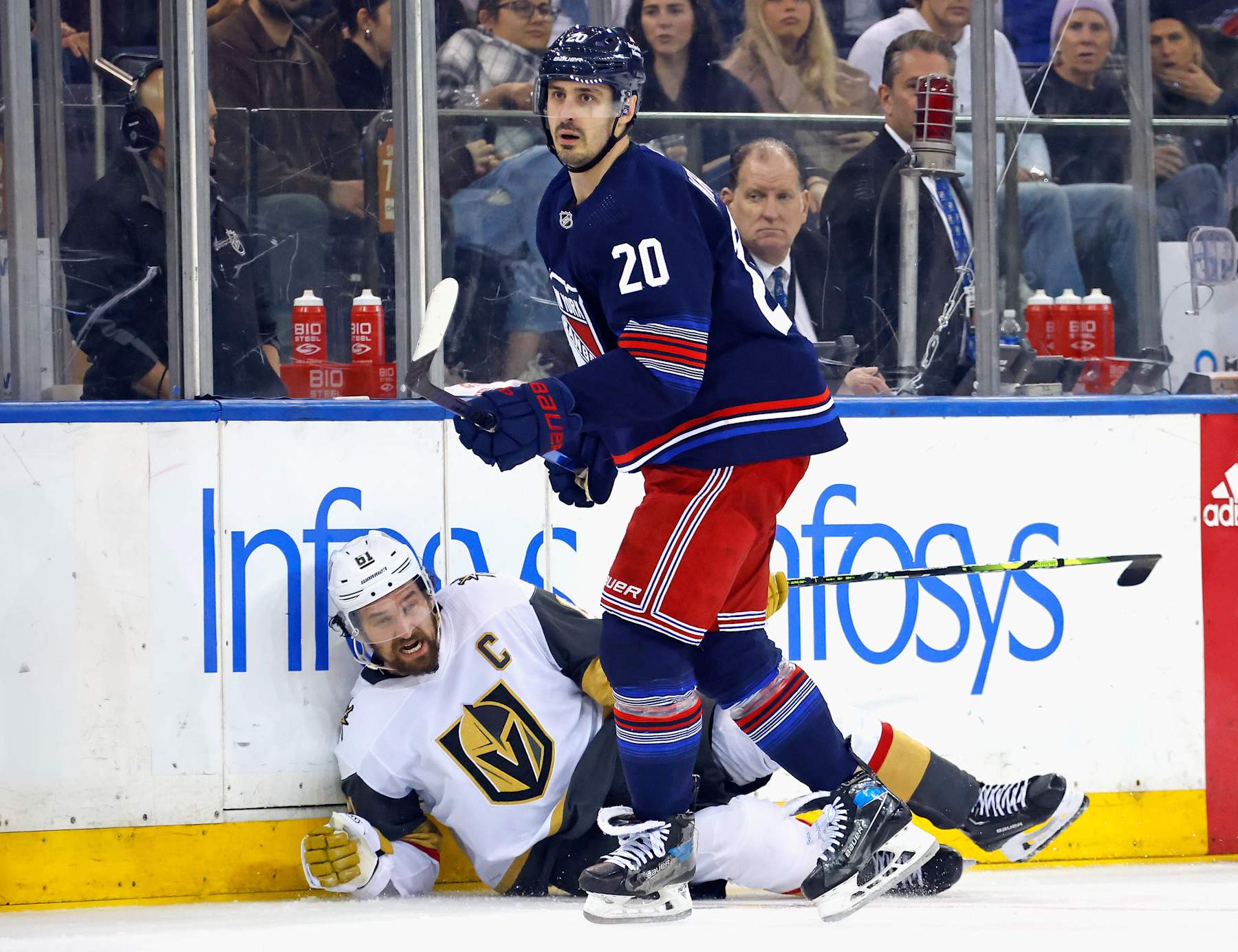 NEW YORK, NEW YORK - JANUARY 26: Mark Stone #61 of the Vegas Golden Knights is checked by Chris Kreider #20 of the New York Rangers during the third period at Madison Square Garden on January 26, 2024 in New York City. The Golden Knights defeated the Rangers 5-2. (Photo by Bruce Bennett/Getty Images)