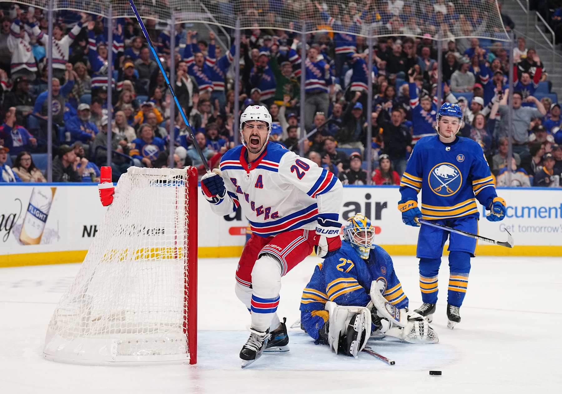 BUFFALO, NEW YORK - OCTOBER 12: Chris Kreider #20 of the New York Rangers c celebrates his second goal of the game against Devon Levi #27 of the Buffalo Sabres during an NHL game on October 12, 2023 at KeyBank Center in Buffalo, New York. New York won, 5-1. (Photo by Bill Wippert/NHLI via Getty Images)