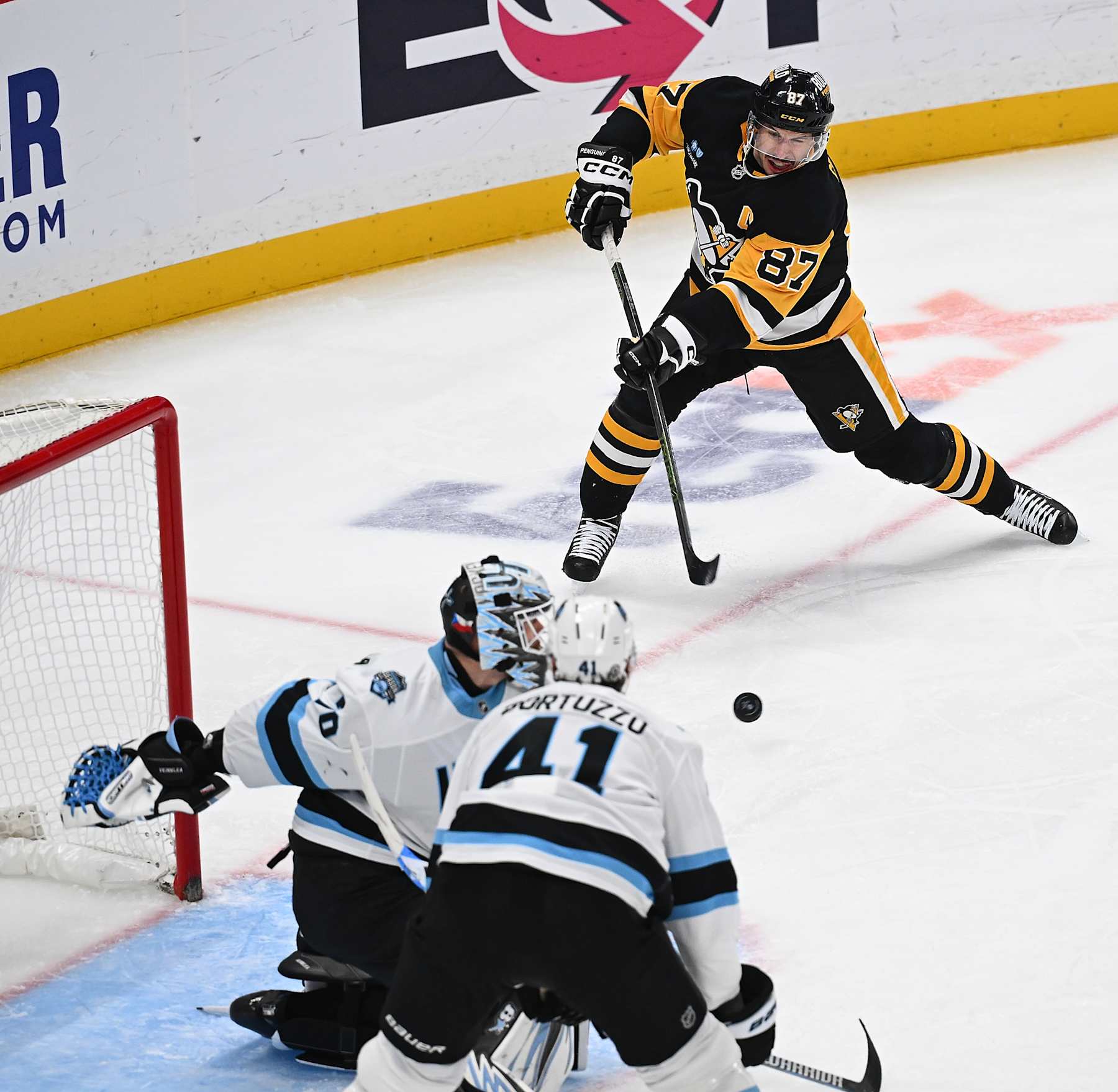 PITTSBURGH, PENNSYLVANIA - NOVEMBER 23: Sidney Crosby #87 of the Pittsburgh Penguins scores a goal past Karel Vejmelka #70 of the Utah Hockey Club for his 600th career goal in the second period during the game at PPG PAINTS Arena on November 23, 2024 in Pittsburgh, Pennsylvania. (Photo by Justin Berl/Getty Images)