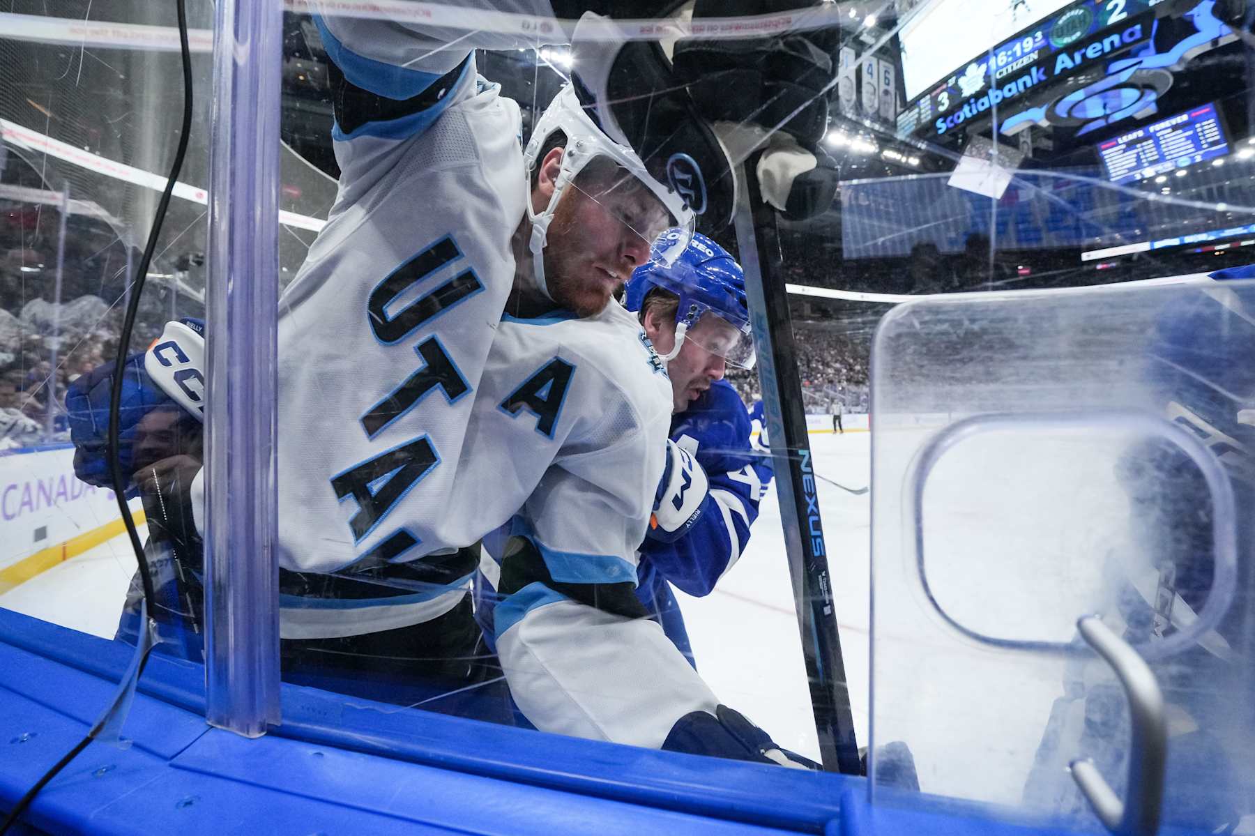 TORONTO, CANADA - NOVEMBER 24: Lawson Crouse #67 of the Utah Hockey Club battles with Morgan Rielly #44 of the Toronto Maple Leafs during the third period at Scotiabank Arena on November 24, 2024 in Toronto, Ontario, Canada. (Photo by Chris Tanouye/Getty Images)
