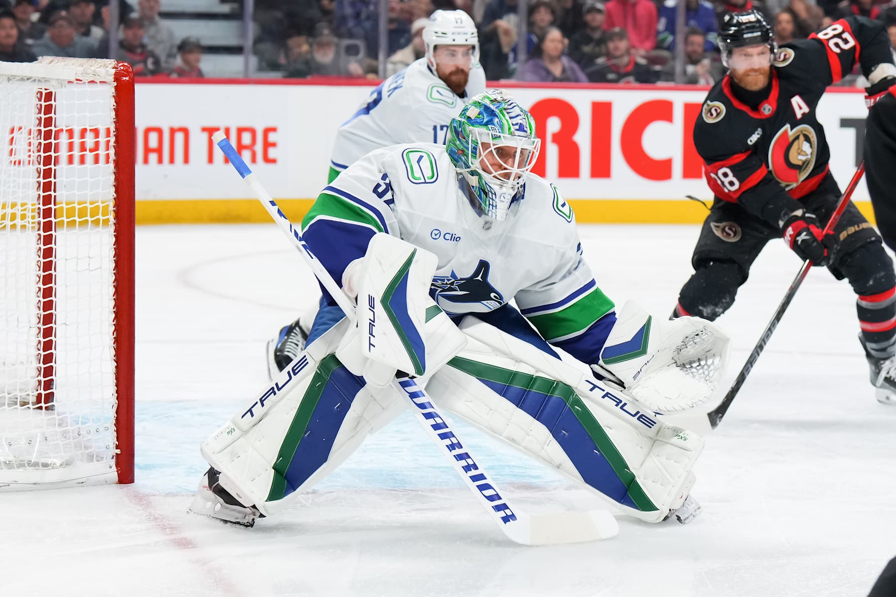 OTTAWA, CANADA - NOVEMBER 23: Kevin Lankinen #32 of the Vancouver Canucks tends net against the Ottawa Senators at Canadian Tire Centre on November 23, 2024 in Ottawa, Ontario, Canada. (Photo by André Ringuette/NHLI via Getty Images)