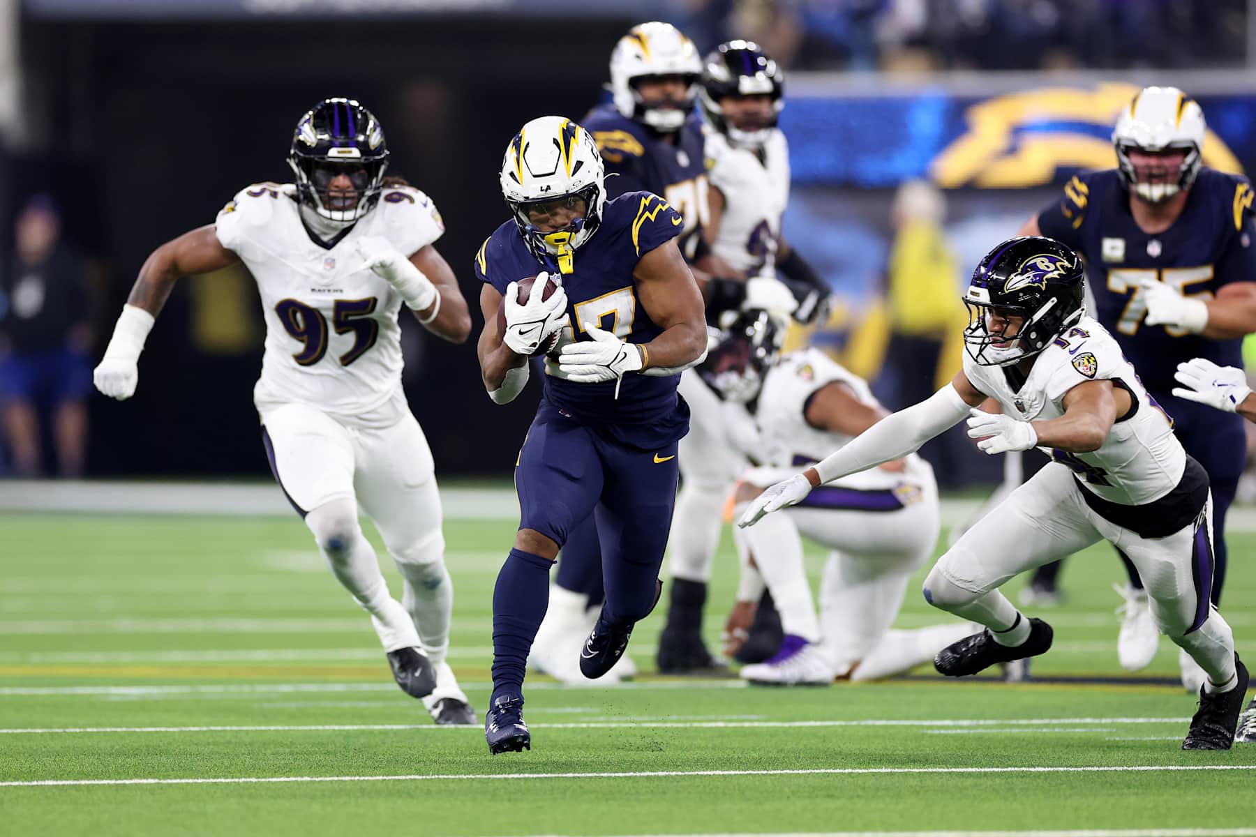 INGLEWOOD, CALIFORNIA - NOVEMBER 25: J.K. Dobbins #27 of the Los Angeles Chargers runs with the ball against the Baltimore Ravens during the first quarter in the game at SoFi Stadium on November 25, 2024 in Inglewood, California. (Photo by Sean M. Haffey/Getty Images)