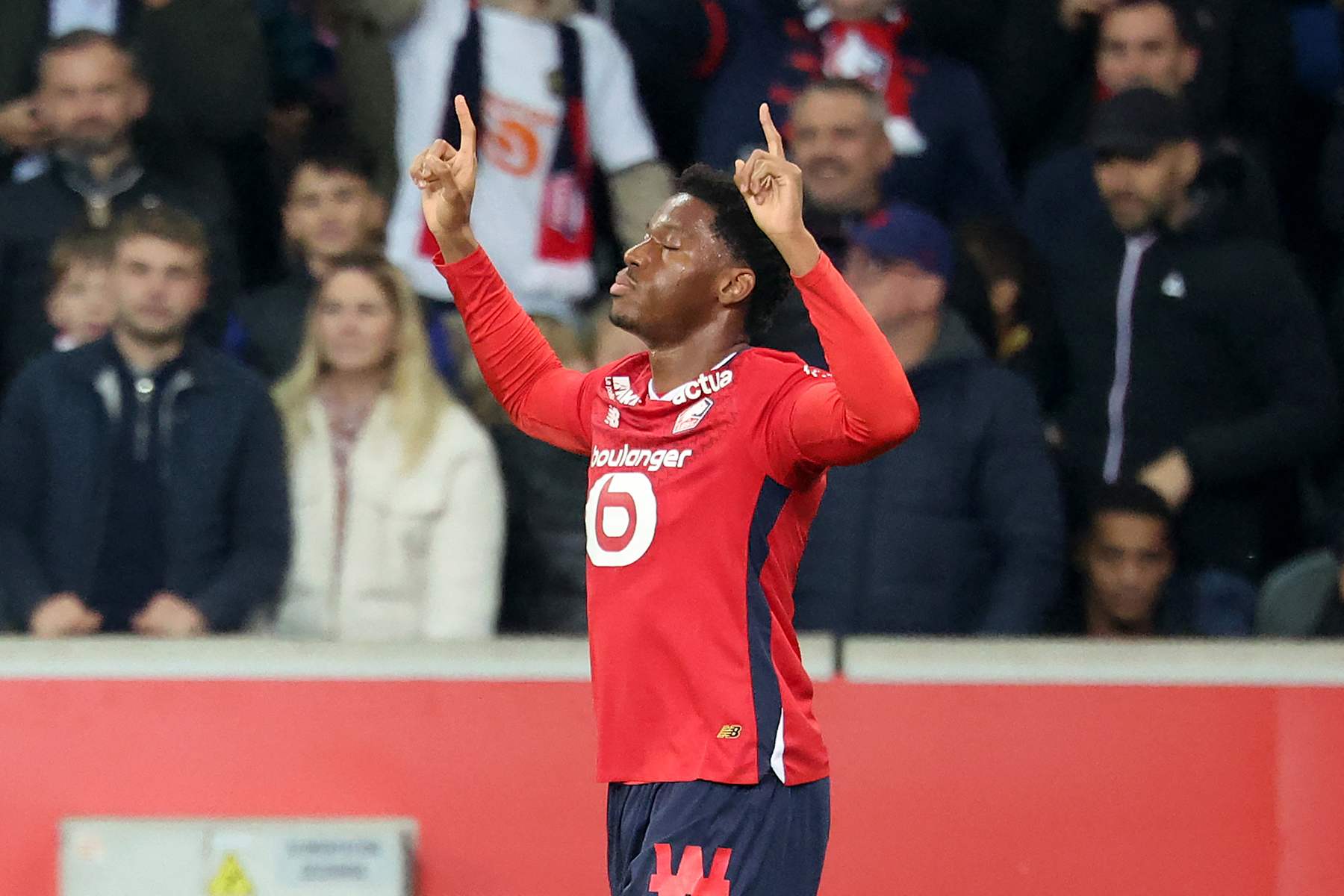 Lille's Canadian forward #09 Jonathan David celebrates after scoring his team's first goal during the French L1 football match between Lille LOSC and Olympique Lyonnais (OL) at Stade Pierre-Mauroy in Villeneuve-d'Ascq, northern France on November 1, 2024. (Photo by FRANCOIS LO PRESTI / AFP) (Photo by FRANCOIS LO PRESTI/AFP via Getty Images)