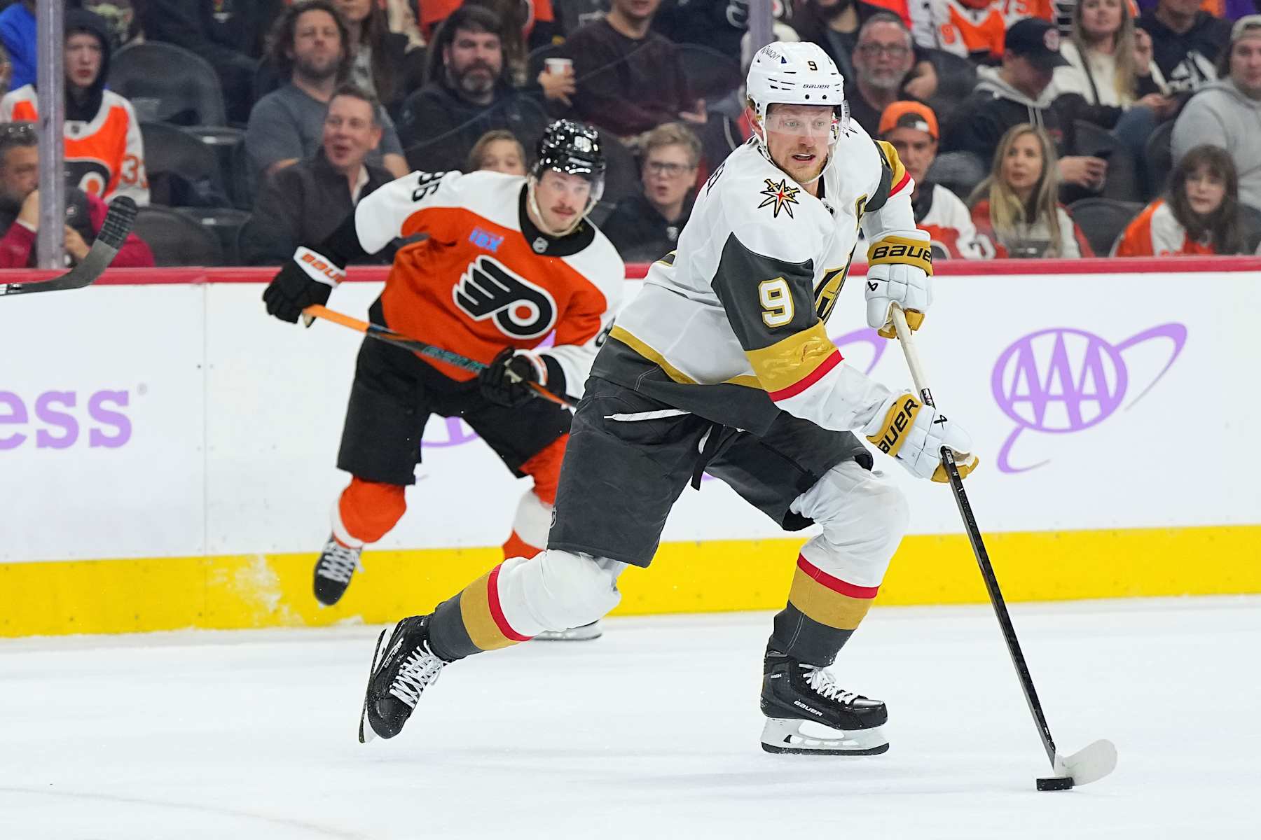 PHILADELPHIA, PENNSYLVANIA - NOVEMBER 25: Jack Eichel #9 of the Vegas Golden Knights controls the puck against Joel Farabee #86 of the Philadelphia Flyers in the third period at the Wells Fargo Center on November 25, 2024 in Philadelphia, Pennsylvania. The Golden Knights defeated the Flyers 5-4 in a shootout. (Photo by Mitchell Leff/Getty Images)