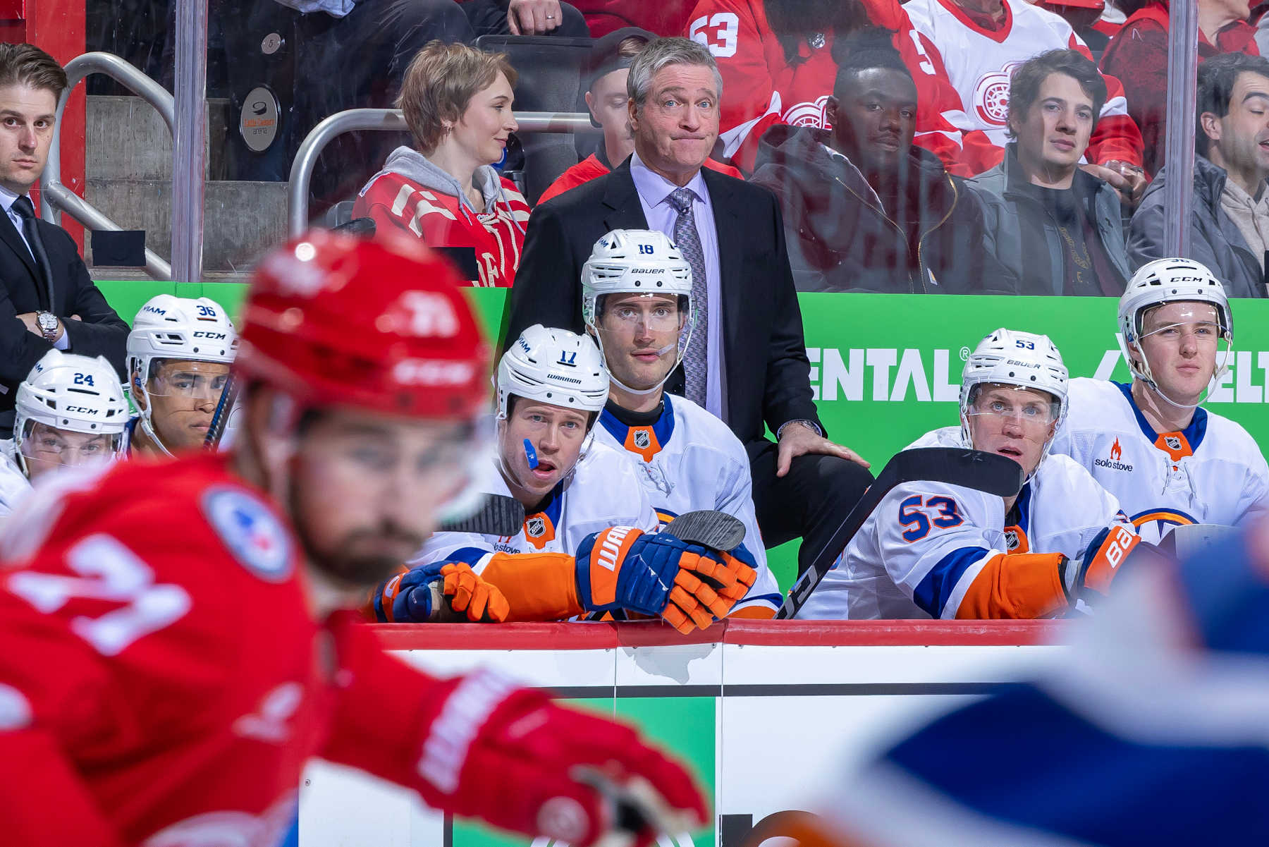 DETROIT, MICHIGAN-NOVEMBER 21: Head coach Patrick Roy of the New York Islanders watches the action from the bench against the Detroit Red Wings during the third period at Little Caesars Arena on November 21, 2024 in Detroit, Michigan. (Photo by Dave Reginek/NHLI via Getty Images)