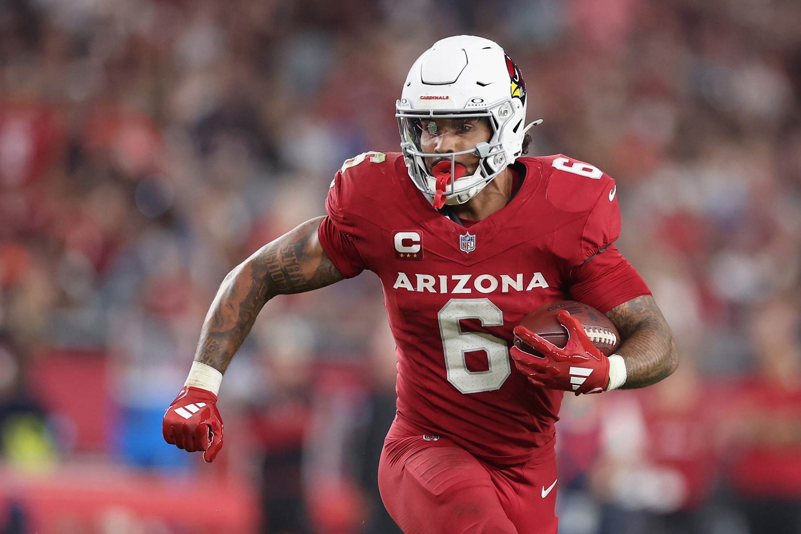 GLENDALE, ARIZONA - NOVEMBER 03: James Conner #6 of the Arizona Cardinals rushes the football against the Chicago Bears during the NFL game at State Farm Stadium on November 03, 2024 in Glendale, Arizona. The Cardinals defeated the Bears 29-9.  (Photo by Christian Petersen/Getty Images)