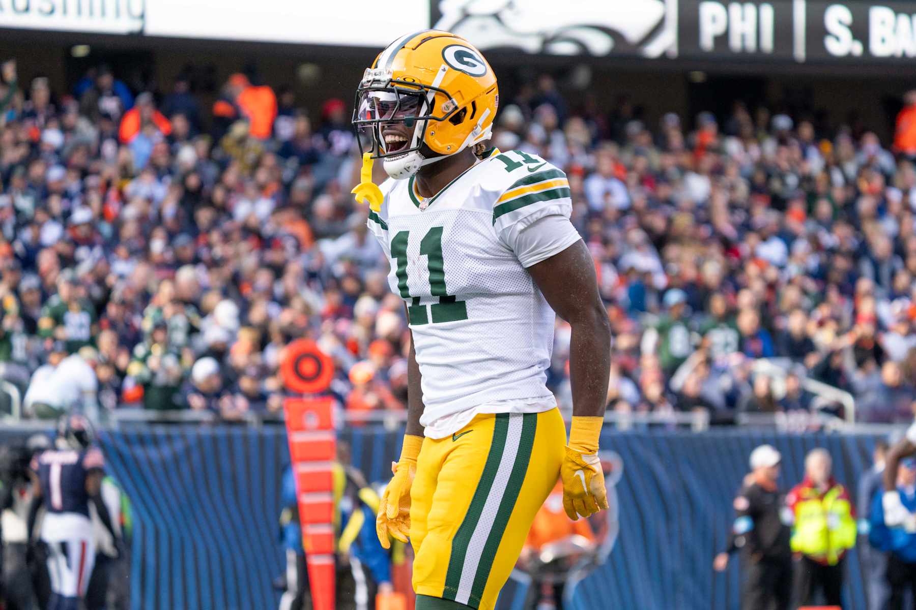 CHICAGO, IL - NOVEMBER 17: Jayden Reed #11 of the Green Bay Packers celebrates after rushing in for a touchdown during the game between the Green Bay Packers and the Chicago Bears at Soldier Field on November 17, 2024. (Photo by Ben Hsu/Icon Sportswire via Getty Images)