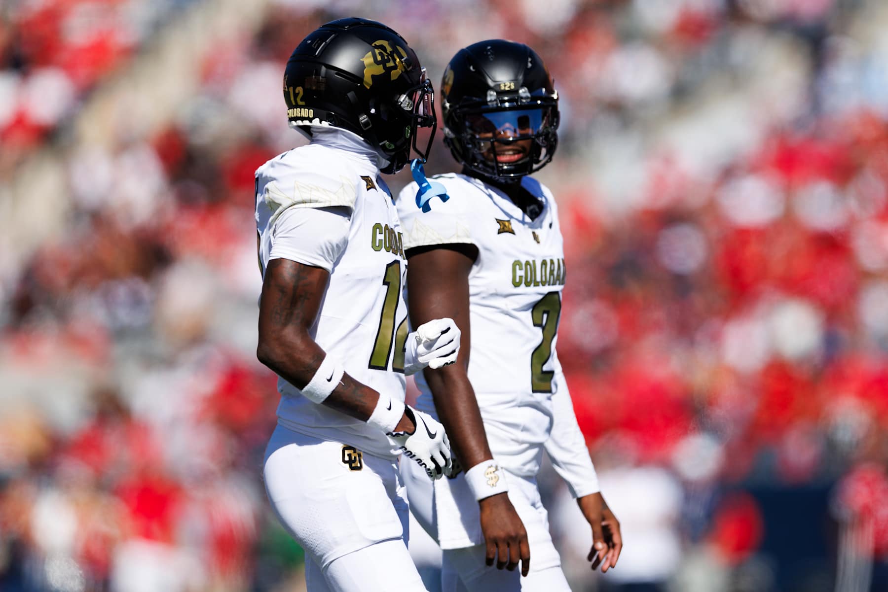 TUCSON, ARIZONA - OCTOBER 19: Travis Hunter #12 of the Colorado Buffaloes and Shedeur Sanders #2 of the Colorado Buffaloes during the first half against Arizona Wildcats at Arizona Stadium on October 19, 2024 in Tucson, Arizona. (Photo by Ric Tapia/Getty Images)