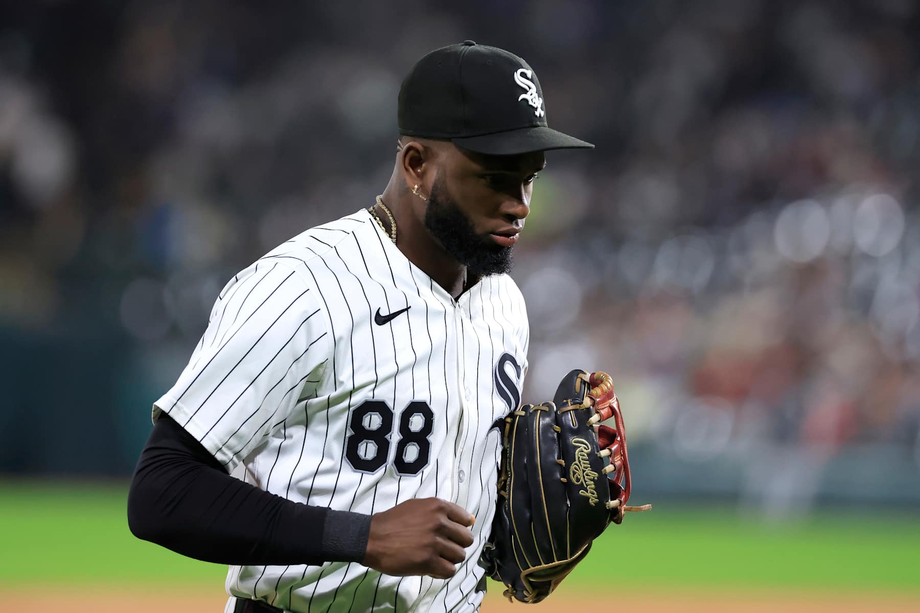 CHICAGO, ILLINOIS - SEPTEMBER 24: Luis Robert Jr. #88 of the Chicago White Sox runs back to the dugout against the Los Angeles Angels at Guaranteed Rate Field on September 24, 2024 in Chicago, Illinois. (Photo by Justin Casterline/Getty Images)