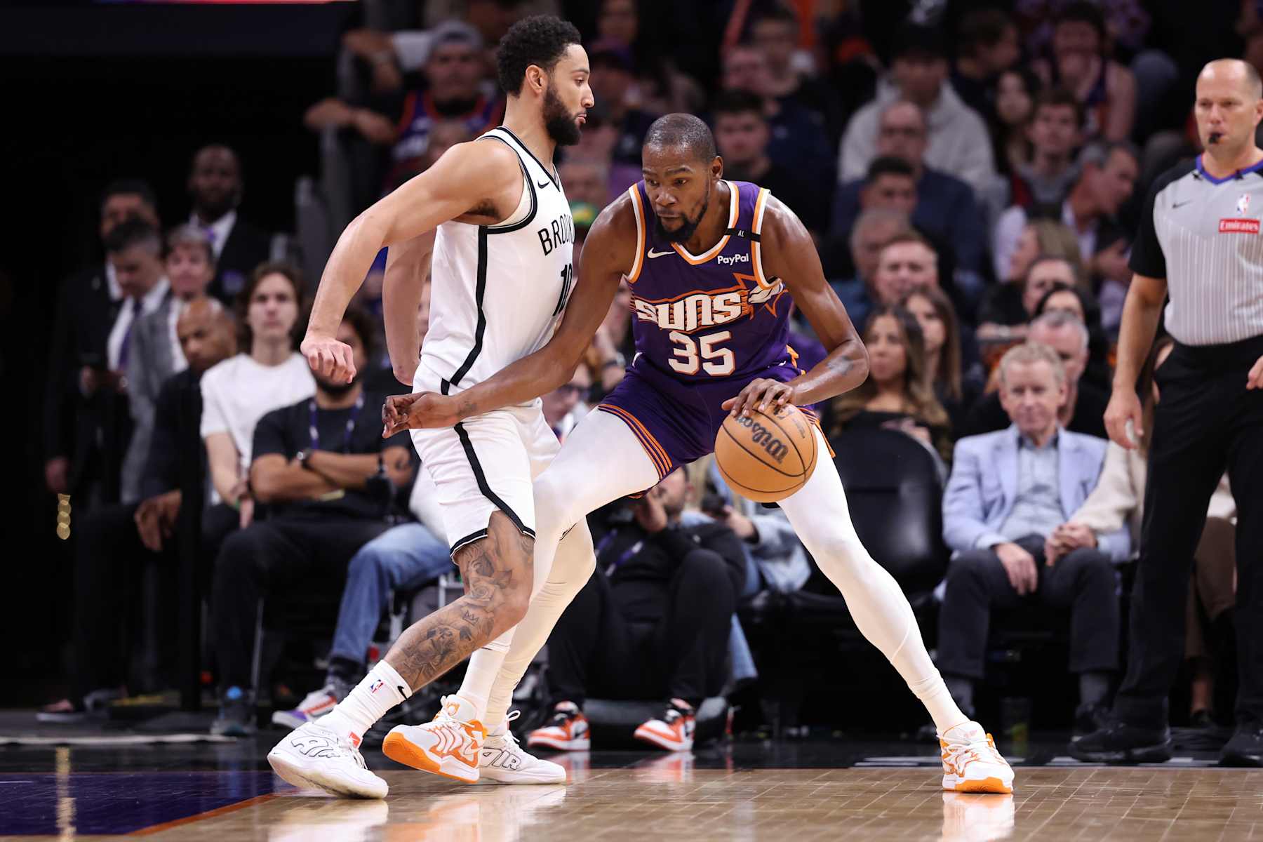 PHOENIX, ARIZONA - NOVEMBER 27: Kevin Durant #35 of the Phoenix Suns posts up on Ben Simmons #10 of the Brooklyn Nets during the first half at Footprint Center on November 27, 2024 in Phoenix, Arizona. NOTE TO USER: User expressly acknowledges and agrees that, by downloading and or using this photograph, User is consenting to the terms and conditions of the Getty Images License Agreement.  (Photo by Chris Coduto/Getty Images)