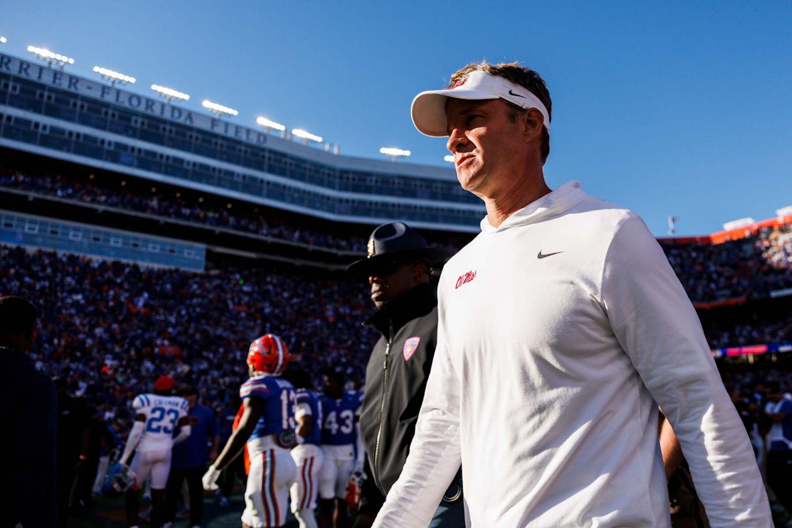 GAINESVILLE, FLORIDA - NOVEMBER 23: Head coach Lane Kiffin of the Mississippi Rebels walks off the field after being defeated 24-17 by the Florida Gators of a game at Ben Hill Griffin Stadium on November 23, 2024 in Gainesville, Florida. (Photo by James Gilbert/Getty Images)