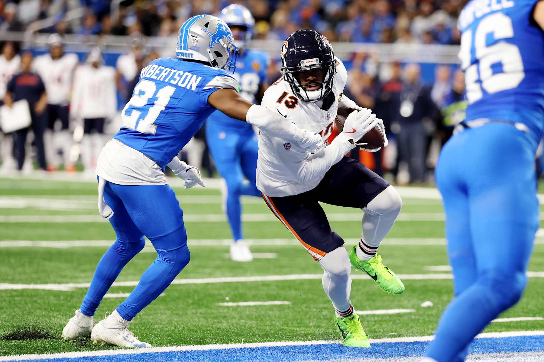 DETROIT, MICHIGAN - NOVEMBER 28: Keenan Allen #13 of the Chicago Bears runs the ball in for a fourth quarter touchdown against Amik Robertson #21 of the Detroit Lions at Ford Field on November 28, 2024 in Detroit, Michigan. (Photo by Gregory Shamus/Getty Images)