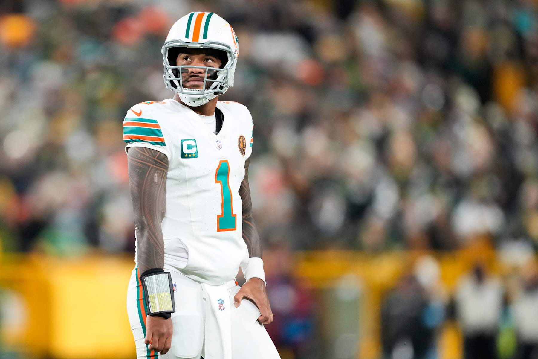 GREEN BAY, WISCONSIN - NOVEMBER 28: Tua Tagovailoa #1 of the Miami Dolphins reacts after an incomplete pass against the Green Bay Packers during the first half of the game at Lambeau Field on November 28, 2024 in Green Bay, Wisconsin. (Photo by Patrick McDermott/Getty Images)