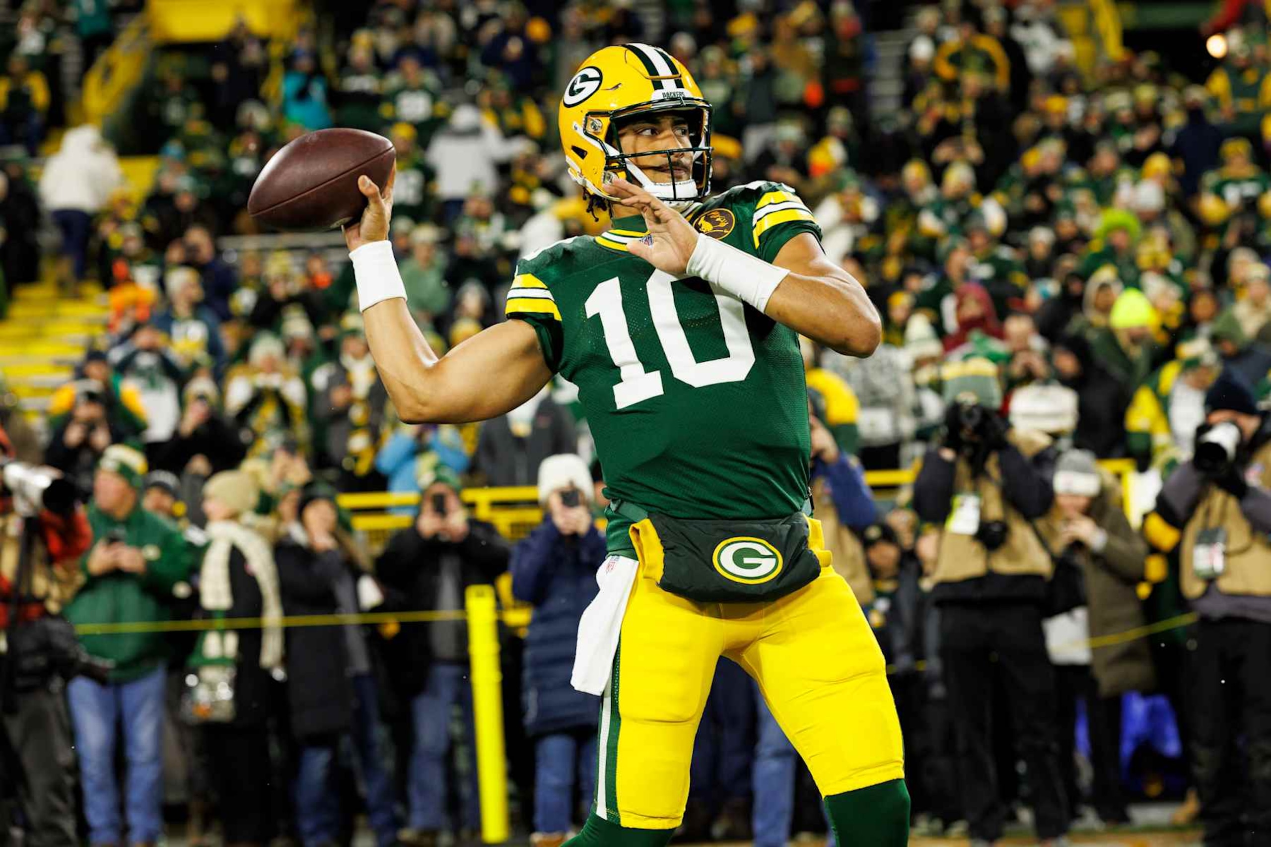 GREEN BAY, WISCONSIN - NOVEMBER 28: Quarterback Jordan Love #10 of the Green Bay Packers warms up prior to an NFL football game against the Miami Dolphins, at Lambeau Field on November 28, 2024 in Green Bay, Wisconsin. (Photo by Brooke Sutton/Getty Images)