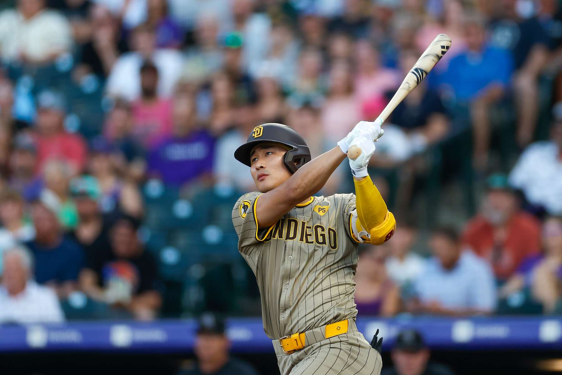 DENVER, COLORADO - AUGUST 16: Ha-Seong Kim #7 of the San Diego Padres watches his two-run home run in the second inning during a game against the Colorado Rockies at Coors Field on August 16, 2024 in Denver, Colorado. (Photo by Brandon Sloter/Image Of Sport/Getty Images)