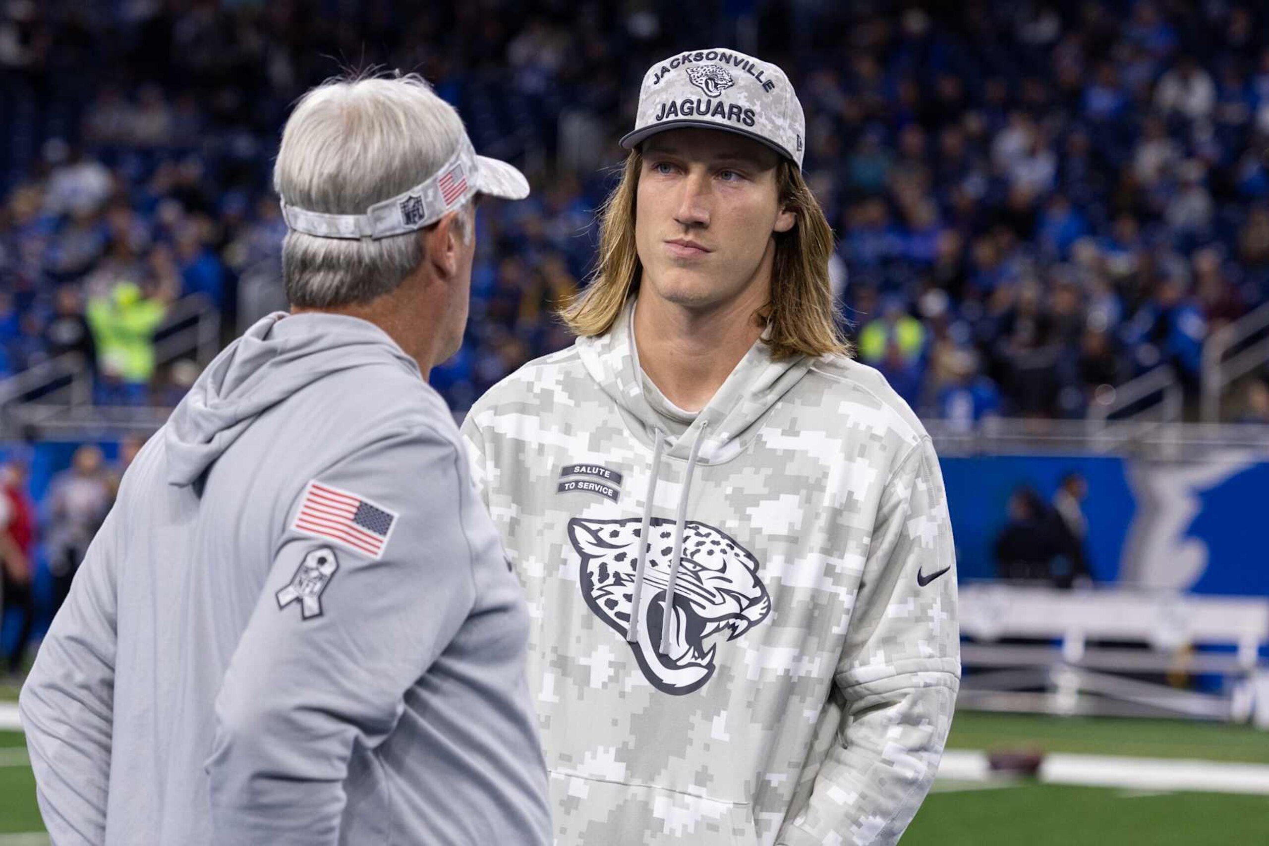 DETROIT, MICHIGAN - NOVEMBER 17: Trevor Lawrence #16 of the Jacksonville Jaguars talks with head coach Doug Pederson before a game against the Detroit Lions at Ford Field on November 17, 2024 in Detroit, Michigan. The Lions defeated the Jaguars 52-6. (Kara Durrette/Getty Images)