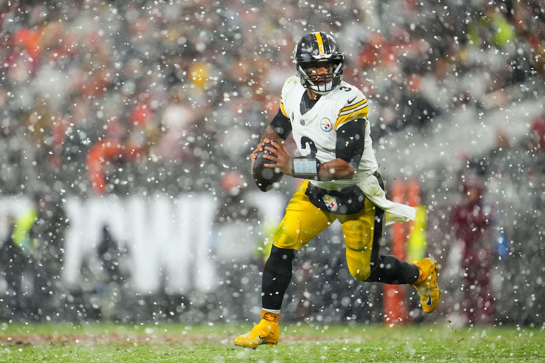 CLEVELAND, OH - NOVEMBER 21: Russell Wilson #3 of the Pittsburgh Steelers scrambles out of the pocket during an NFL football game against the Cleveland Browns at Huntington Bank Field on November 21, 2024 in Cleveland, Ohio. (Photo by Cooper Neill/Getty Images)