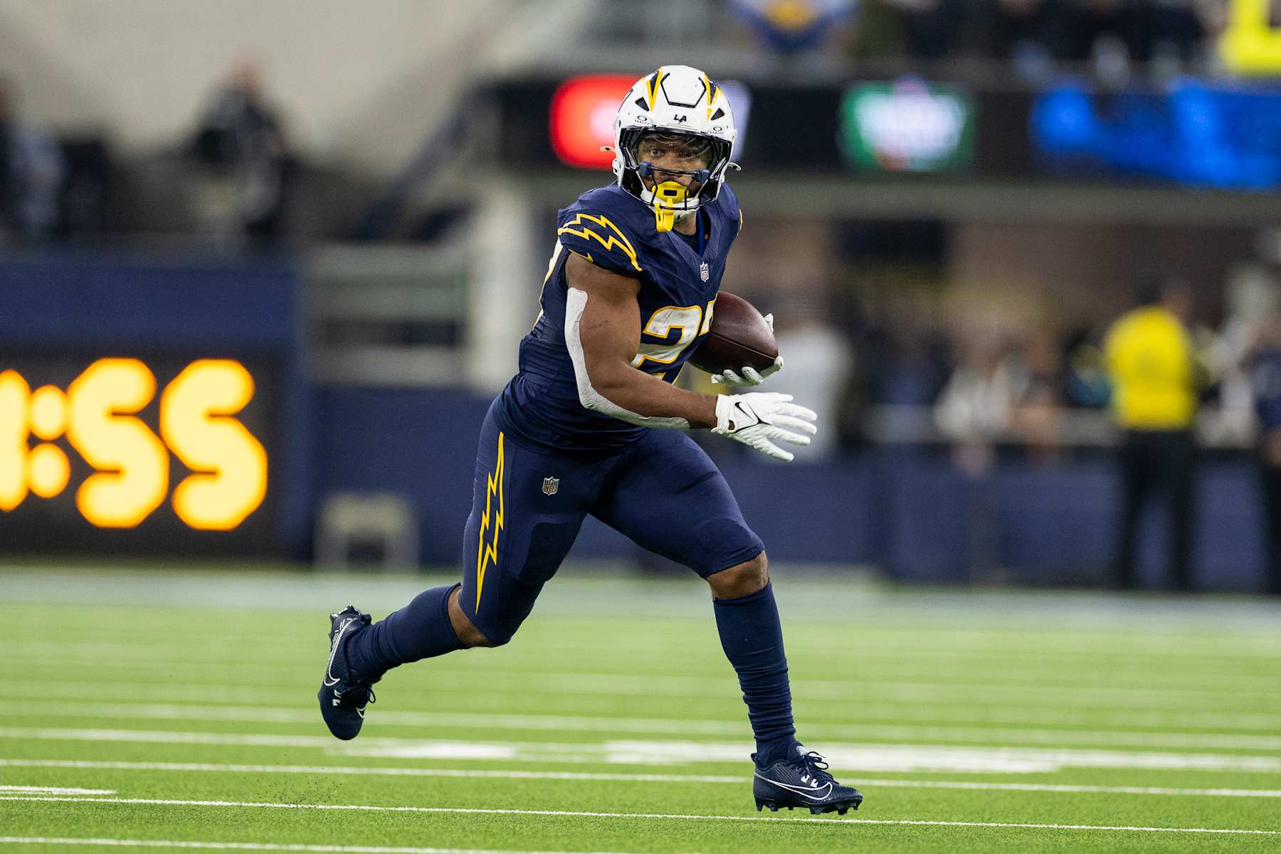 INGLEWOOD, CALIFORINA - NOVEMBER 25: J.K. Dobbins #27 of the Los Angeles Chargers runs with the ball during an NFL Football game against the Baltimore Ravens at SoFi Stadium on November 25, 2024 in Inglewood, Califorina. (Photo by Michael Owens/Getty Images)