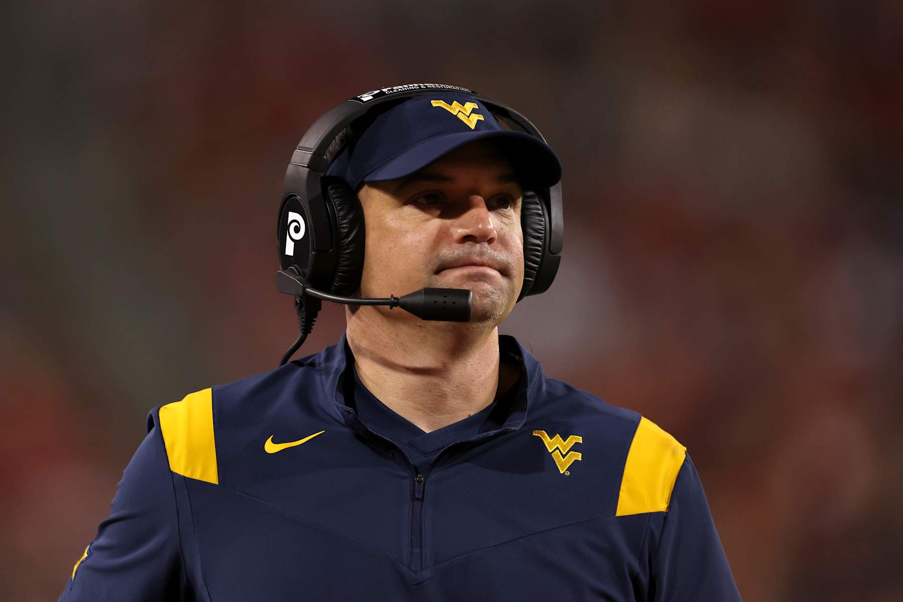 TUCSON, ARIZONA - OCTOBER 26: Head coach Neal Brown of the West Virginia Mountaineers watches the action during the second half against the Arizona Wildcats at Arizona Stadium on October 26, 2024 in Tucson, Arizona. The Mountaineers defeated the Wildcats 31-26. (Photo by Chris Coduto/Getty Images)