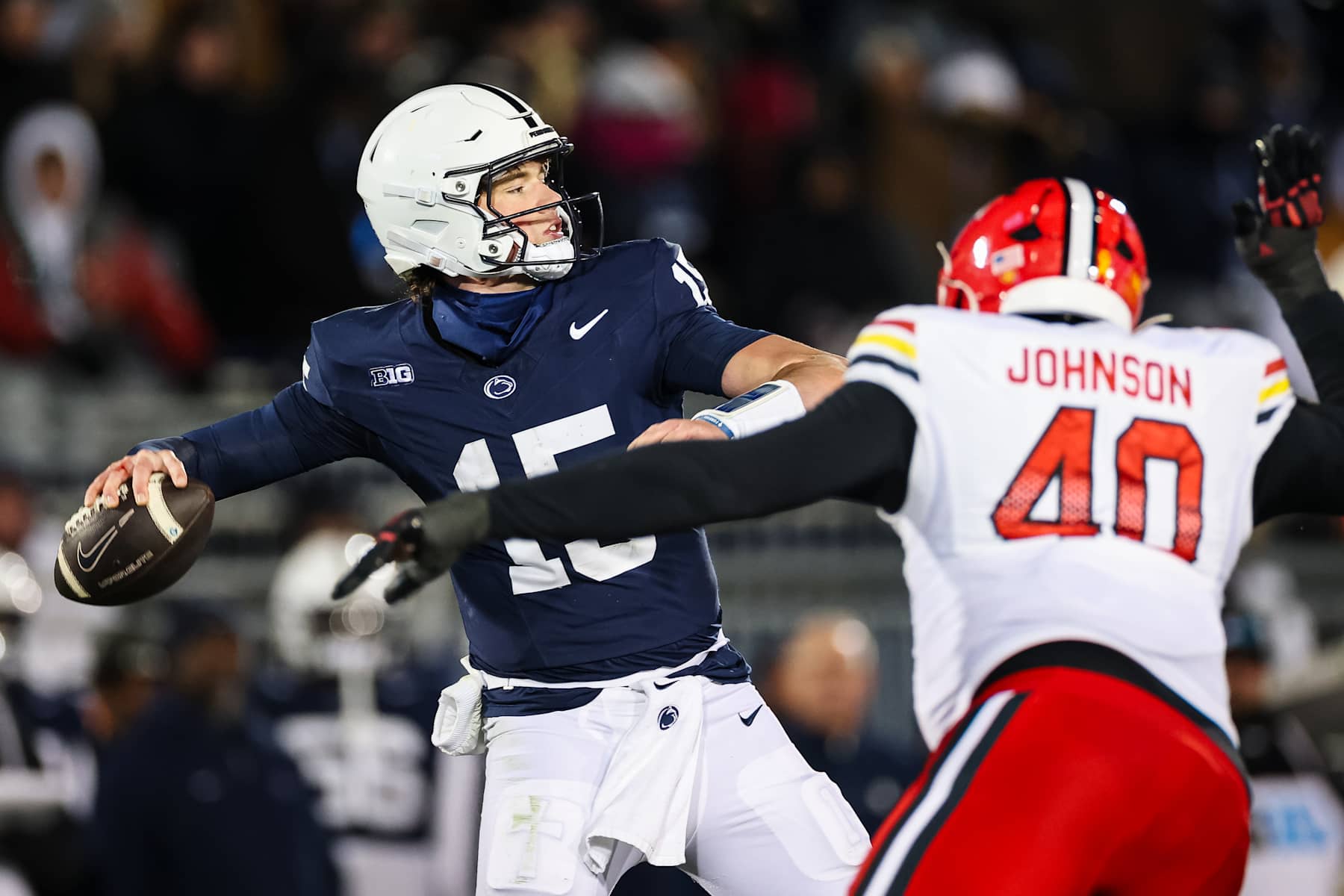 STATE COLLEGE, PA - NOVEMBER 30: Drew Allar #15 of the Penn State Nittany Lions attempts a pass as Taizse Johnson #40 of the Maryland Terrapins applies pressure during the first half at Beaver Stadium on November 30, 2024 in State College, Pennsylvania. (Photo by Scott Taetsch/Getty Images)