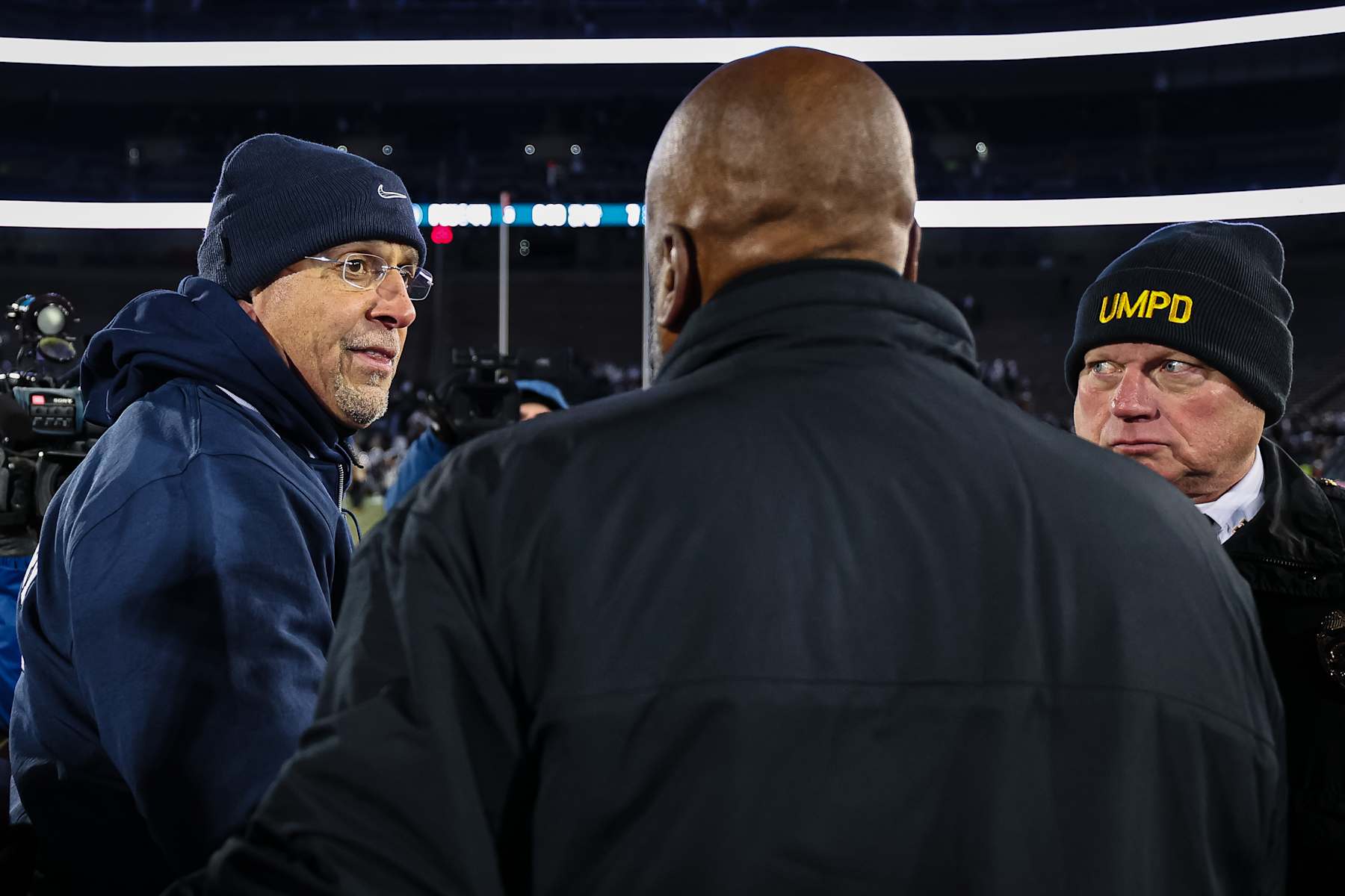 STATE COLLEGE, PA - NOVEMBER 30: Head coach James Franklin of the Penn State Nittany Lions and head coach Michael Locksley of the Maryland Terrapins have words on the field after the game at Beaver Stadium on November 30, 2024 in State College, Pennsylvania. (Photo by Scott Taetsch/Getty Images)