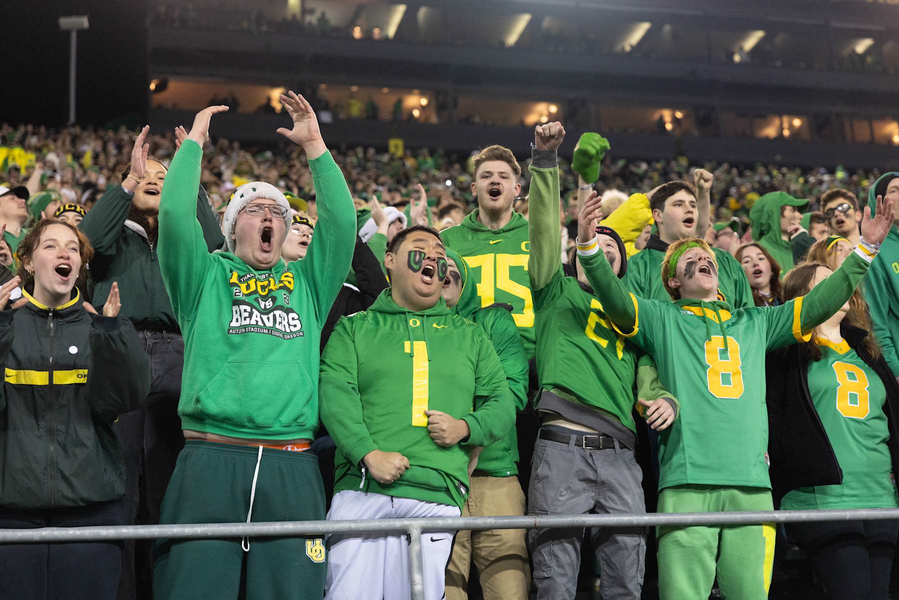 EUGENE, OREGON - NOVEMBER 30: Oregon Ducks fans cheer against the Washington Huskies during the first half at Autzen Stadium on November 30, 2024 in Eugene, Oregon. (Photo by Tom Hauck/Getty Images)