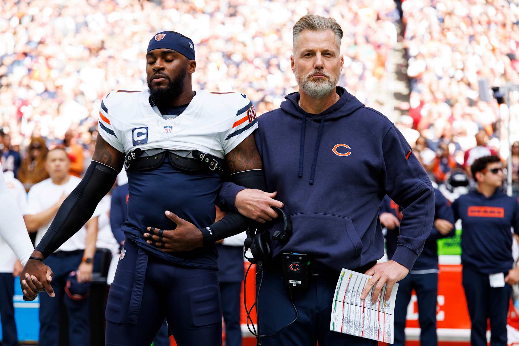 GLENDALE, ARIZONA - NOVEMBER 3: Cornerback Jaylon Johnson #1 of the Chicago Bears and head coach Matt Eberflus stand on the sidelines during the national anthem prior to an NFL football game against the Arizona Cardinals, at State Farm Stadium on November 3, 2024 in Glendale, Arizona. (Photo by Brooke Sutton/Getty Images)