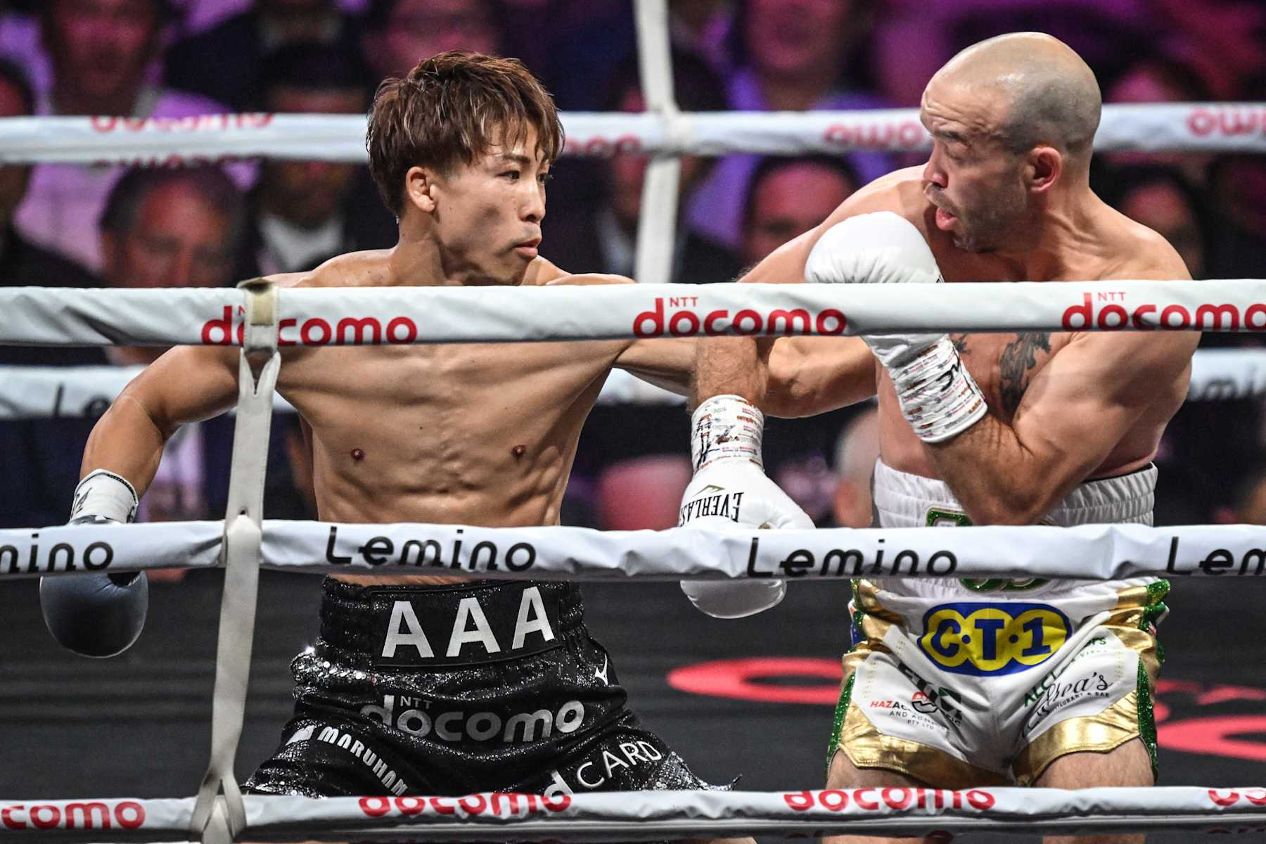 Japan's Naoya Inoue (L) and Ireland's TJ Doheny fight during their IBF-WBA-WBC-WBO super-bantamweight title boxing match at at Ariake Arena in Tokyo on September 3, 2024. (Photo by Yuichi YAMAZAKI / AFP) (Photo by YUICHI YAMAZAKI/AFP via Getty Images)