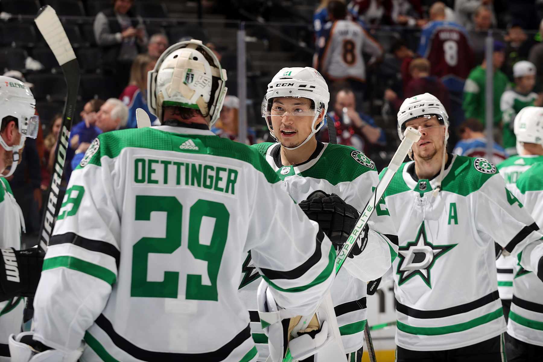 DENVER, COLORADO - MAY 13: Goaltender Jake Oettinger #29, Jason Robertson #21 and Miro Heiskanen #4 of the Dallas Stars celebrate a 5-1 win against the Colorado Avalanche in Game Four of the Second Round of the 2024 Stanley Cup Playoffs at Ball Arena on May 13, 2024 in Denver, Colorado. (Photo by Michael Martin/NHLI via Getty Images)