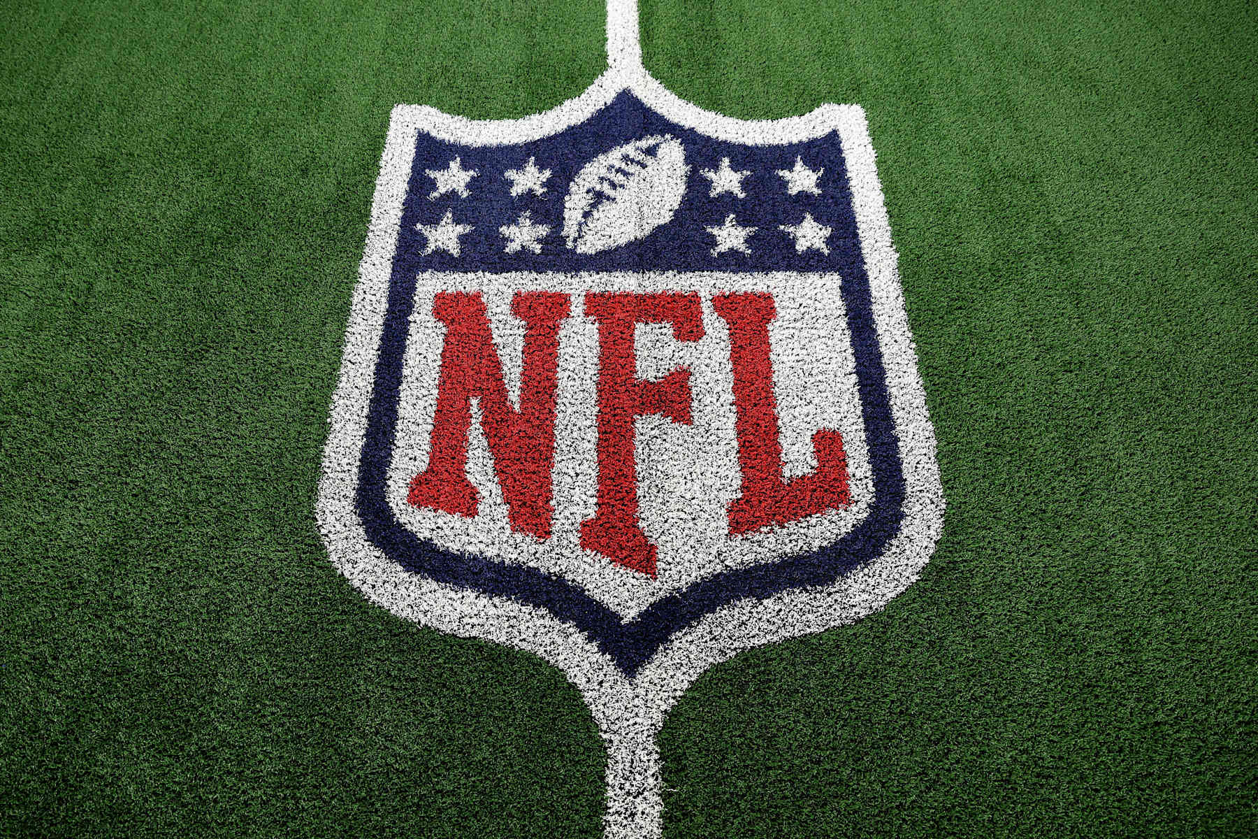 ARLINGTON, TEXAS - NOVEMBER 28: A detail shot of an NFL shield logo painted on the field prior to an NFL football game between the Dallas Cowboys and the New York Giants at AT&T Stadium on November 28, 2024 in Arlington, Texas. (Photo by Kevin Sabitus/Getty Images)