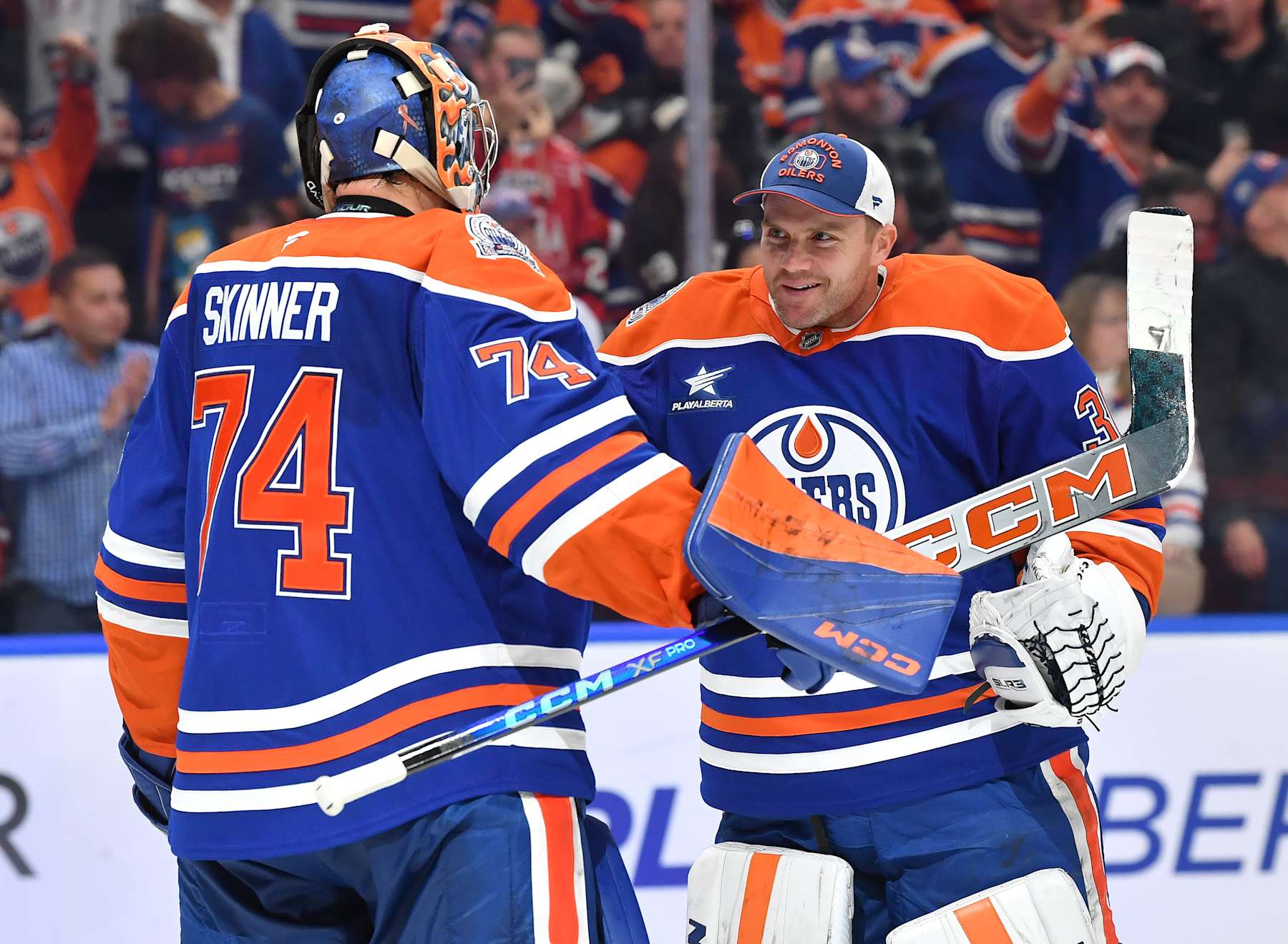 EDMONTON, CANADA - OCTOBER 25: Calvin Pickard #30 and Stuart Skinner #74 of the Edmonton Oilers celebrate a victory over the Pittsburgh Penguins after the game at Rogers Place on October 25, 2024, in Edmonton, Alberta, Canada. (Photo by Andy Devlin/NHLI via Getty Images)