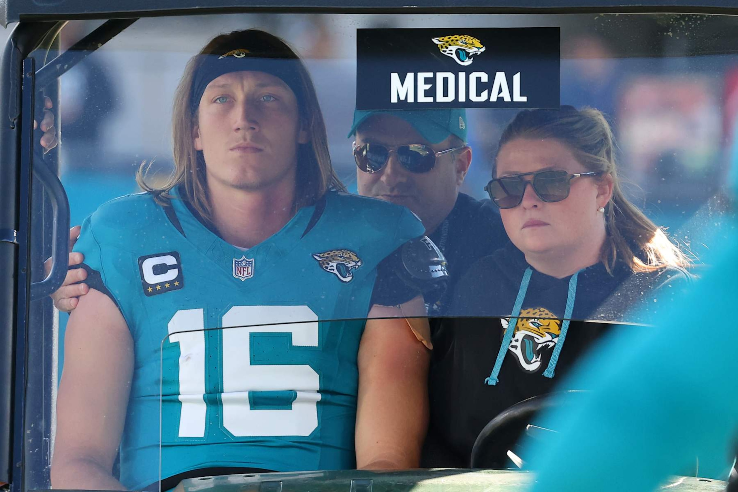 JACKSONVILLE, FLORIDA - DECEMBER 01: Quarterback Trevor Lawrence #16 of the Jacksonville Jaguars is taken off the field in a medical cart during the second quarter of a game against the Houston Texans at EverBank Stadium on December 01, 2024 in Jacksonville, Florida. (Photo by Mike Carlson/Getty Images)