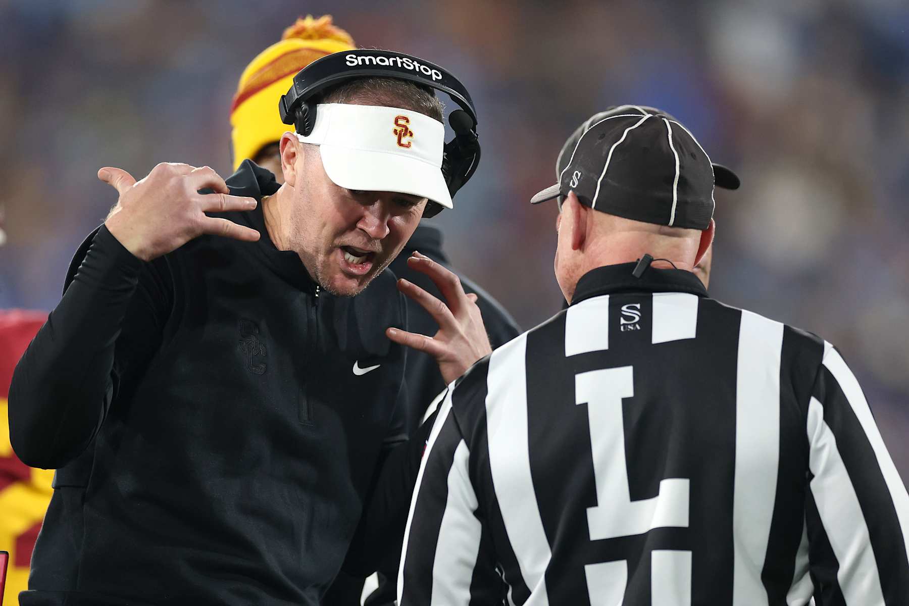 PASADENA, CALIFORNIA - NOVEMBER 23: Head coach Lincoln Riley of the USC Trojans yells at a line judge during the first half of a game against the UCLA Bruins at Rose Bowl on November 23, 2024 in Pasadena, California.  (Photo by Sean M. Haffey/Getty Images)