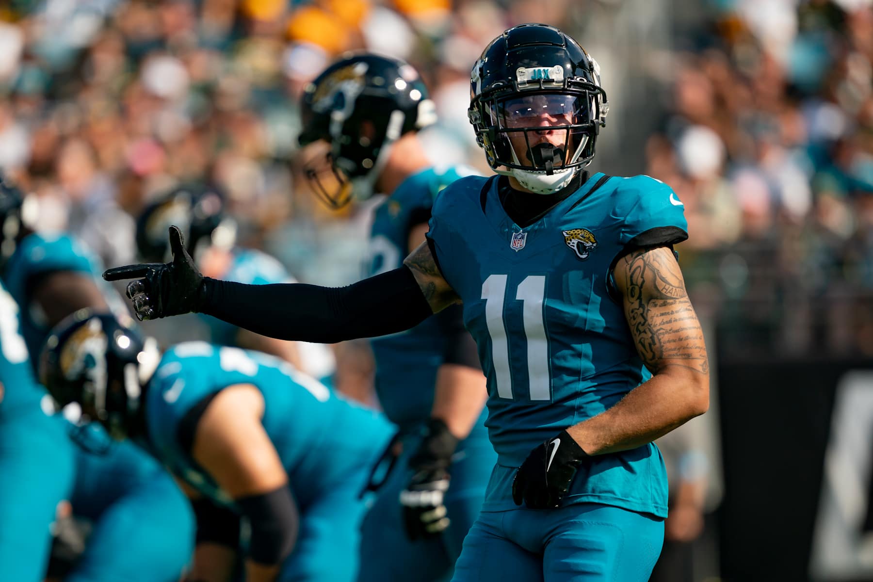 JACKSONVILLE, FL - OCTOBER 27:Jacksonville Jaguars wide receiver Parker Washington (11) signals to the referee during a NFL football game between the Green Bay Packers and the Jacksonville Jaguars on October 27th, 2024 at EverBank Stadium in Jacksonville, FL. (Photo by Chris Leduc/Icon Sportswire via Getty Images)