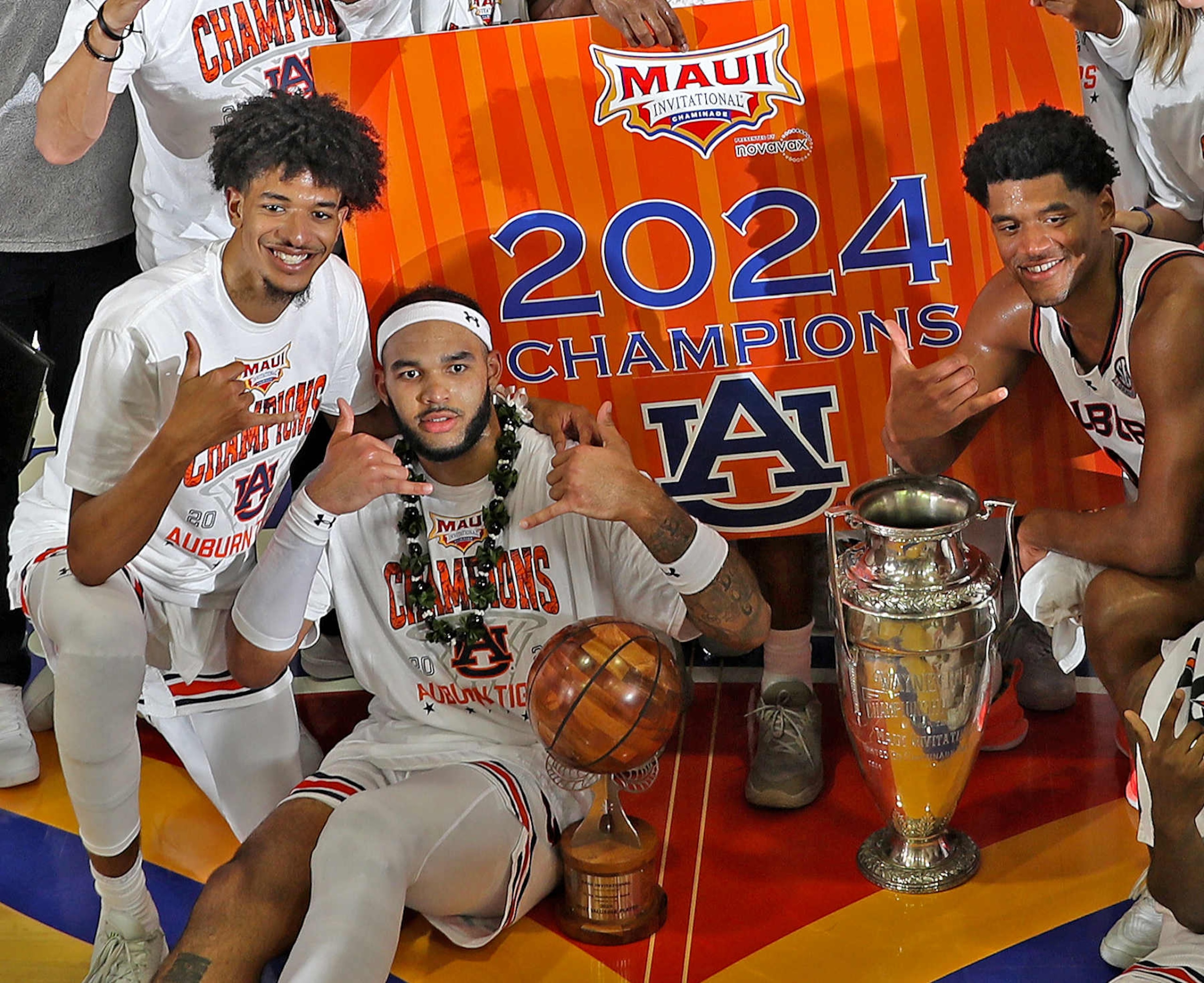 MAUI, HI - NOVEMBER 27: Auburn Tigers forward Johni Broome (4 ) poses with the MVP Trophy and the Wayne Duke Trophy after defeating the Memphis Tigers in the championship game of the Maui Invitational on November 27, 2024, at the Lahaina Civic Center in Maui, Hawaii. (Photo by Brian Spurlock/Icon Sportswire via Getty Images)