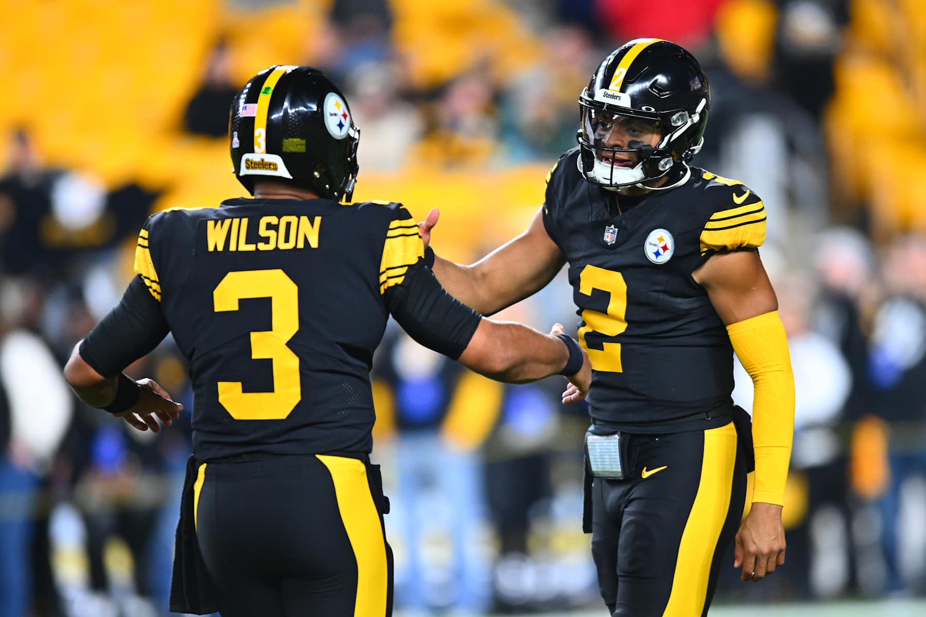 PITTSBURGH, PENNSYLVANIA - OCTOBER 28: Russell Wilson #3 and Justin Fields #2 of the Pittsburgh Steelers warm up prior to the game against the New York Giants at Acrisure Stadium on October 28, 2024 in Pittsburgh, Pennsylvania. (Photo by Joe Sargent/Getty Images)