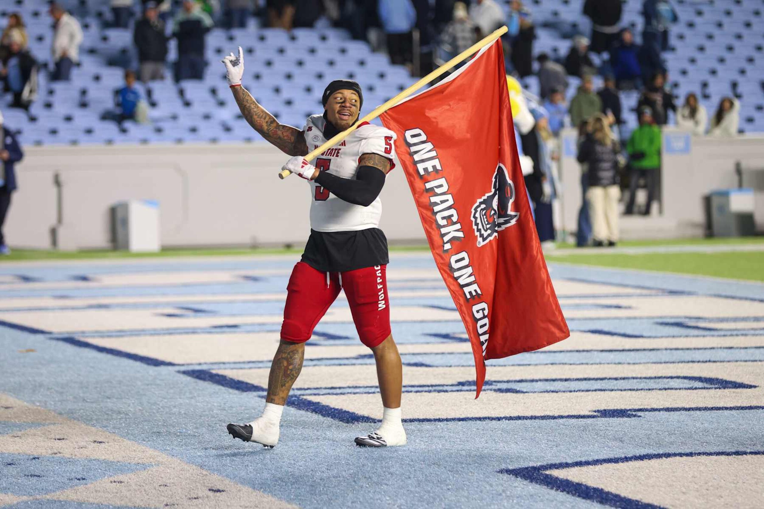 CHAPEL HILL, NC - NOVEMBER 30: North Carolina State Wolfpack safety DK Kaufman (5) waves his wolfie after the college basketball game between the North Carolina Tar Heels and the North Carolina State Wolfpack on November 30, 2024 at Kenan Memorial Stadium in Chapel Hill, NC. (Photo by Nicholas Faulkner/Icon Sportswire via Getty Images)
