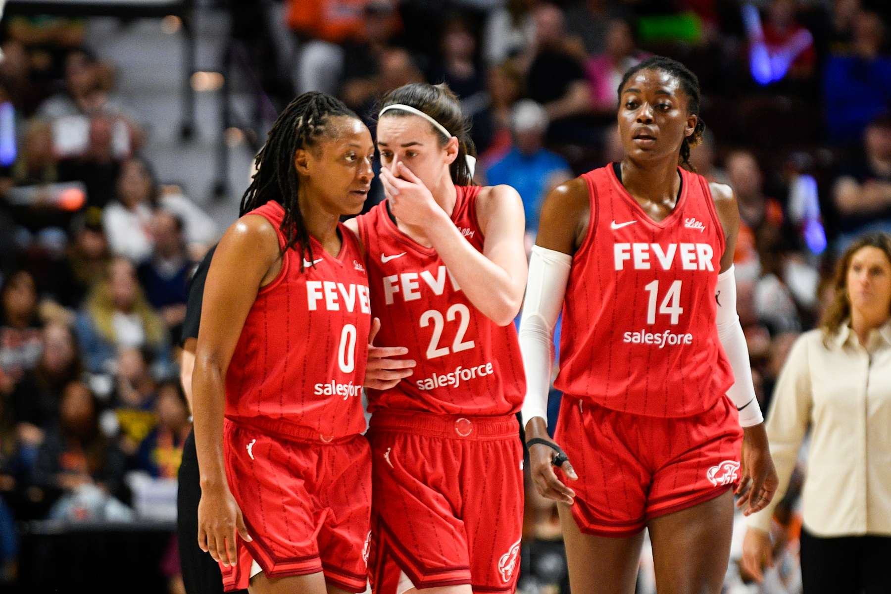UNCASVILLE, CT - SEPTEMBER 25: Indiana Fever guard Caitlin Clark (22) speaks with Indiana Fever guard Kelsey Mitchell (0) during Game 2 of the first round of the WNBA Playoffs between the Indiana Fever and the Connecticut Sun on September 25, 2024, at Mohegan Sun Arena in Uncasville, CT. (Photo by Erica Denhoff/Icon Sportswire via Getty Images)