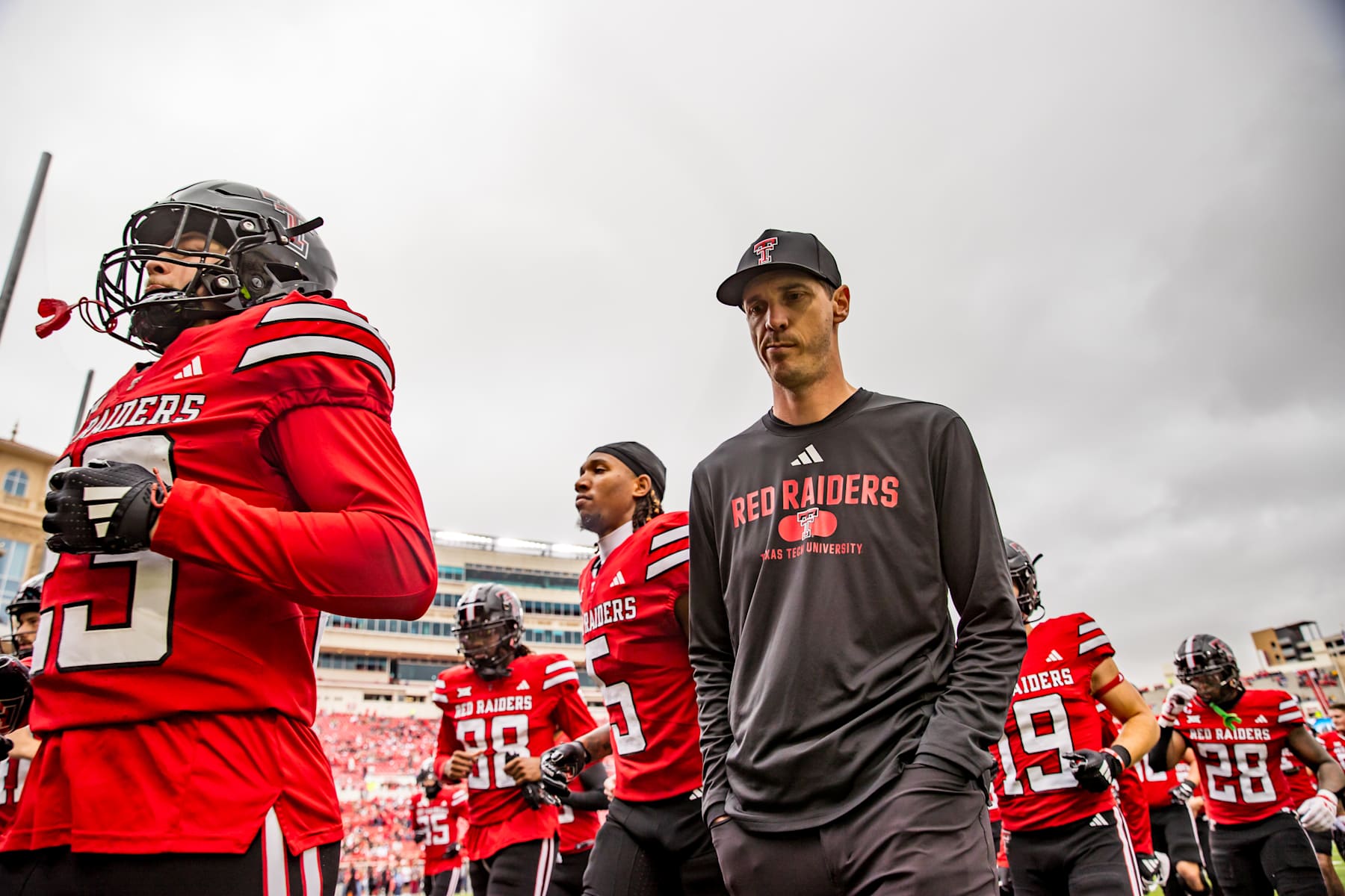 LUBBOCK, TEXAS - OCTOBER 19: Offensive coordinator Zach Kittley of the Texas Tech Red Raiders walks off the field before the game against the Baylor Bears at Jones AT&T Stadium on October 19, 2024 in Lubbock, Texas.  (Photo by John E. Moore III/Getty Images)