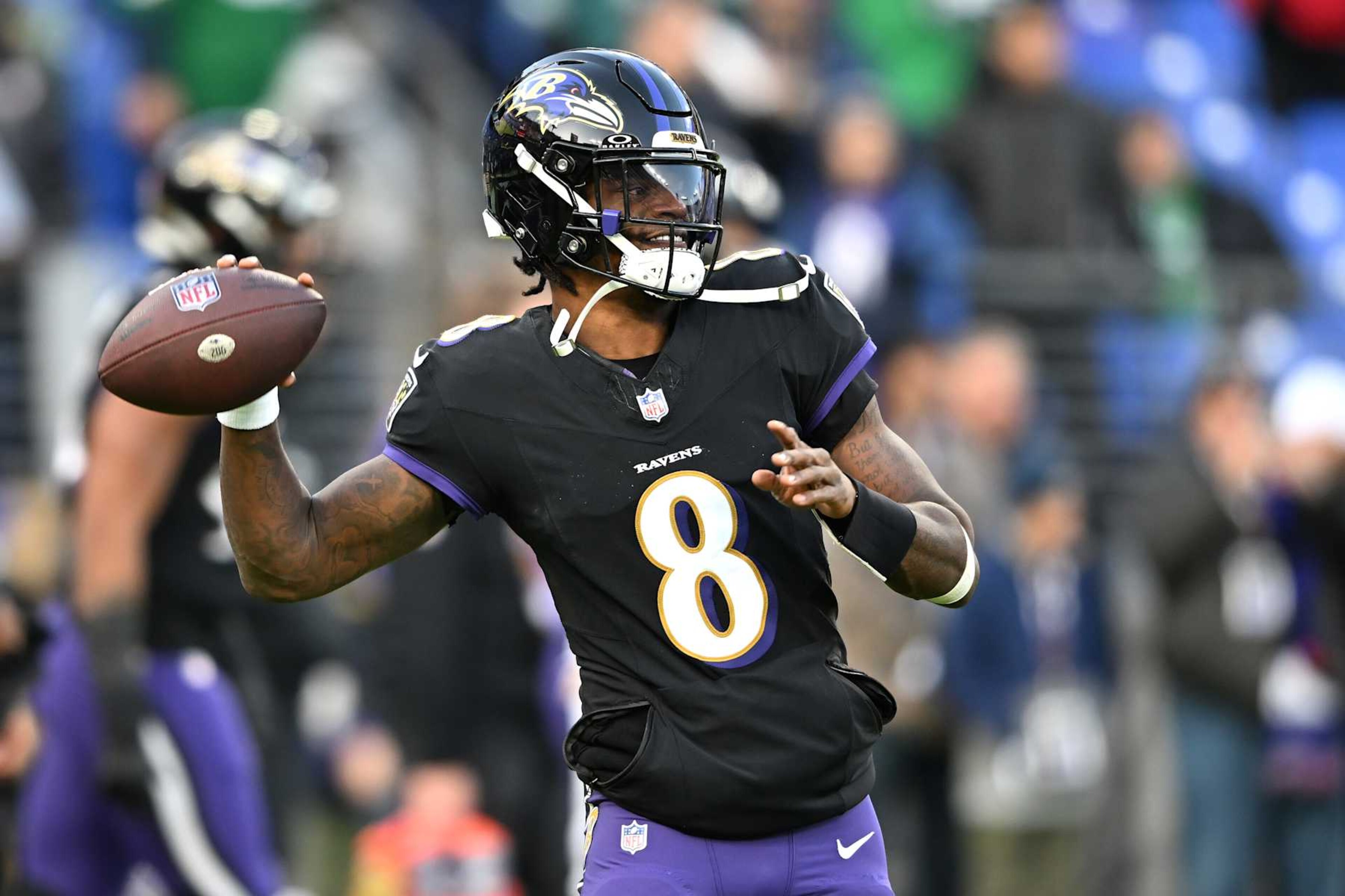 BALTIMORE, MARYLAND - DECEMBER 01: Lamar Jackson #8 of the Baltimore Ravens warms up prior to a game against the Philadelphia Eagles at M&T Bank Stadium on December 01, 2024 in Baltimore, Maryland. (Photo by Greg Fiume/Getty Images) BALTIMORE, MARYLAND - DECEMBER 01: Lamar Jackson #8 of the Baltimore Ravens warms up prior to a game against the Philadelphia Eagles at M&T Bank Stadium on December 01, 2024 in Baltimore, Maryland. (Photo by Greg Fiume/Getty Images)