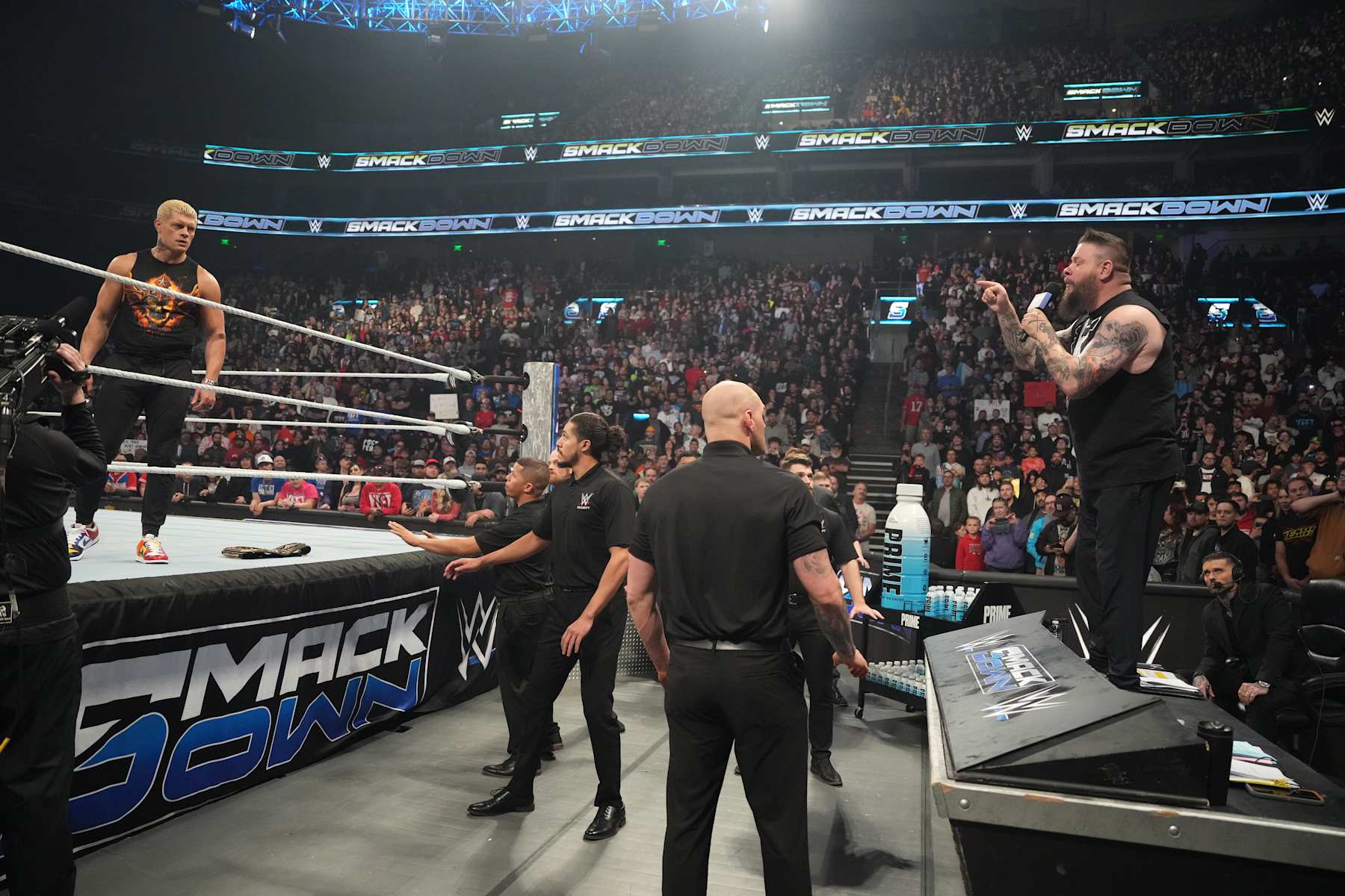 SALT LAKE CITY, UTAH - NOVEMBER 22: Kevin Owens on the microphone and Cody Rhodes during WWE SmackDown at Delta Center on November 22, 2024 in Salt Lake City, Utah. (Photo by WWE/Getty Images)