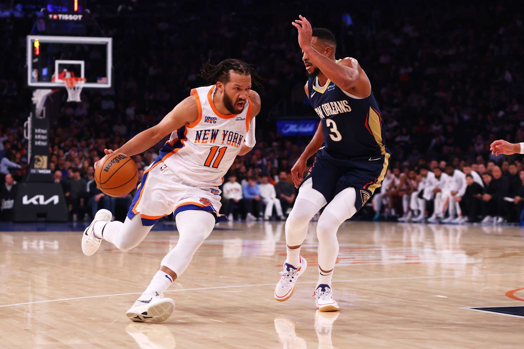 NEW YORK, NEW YORK - DECEMBER 01: Jalen Brunson #11 of the New York Knicks drives to the net against CJ McCollum #3 of the New Orleans Pelicans during the first half at Madison Square Garden on December 01, 2024 in New York City. NOTE TO USER: User expressly acknowledges and agrees that, by downloading and or using this Photograph, user is consenting to the terms and conditions of the Getty Images License Agreement. Mandatory Copyright Notice: Copyright 2024 NBAE (Photo by Mike Stobe/Getty Images)