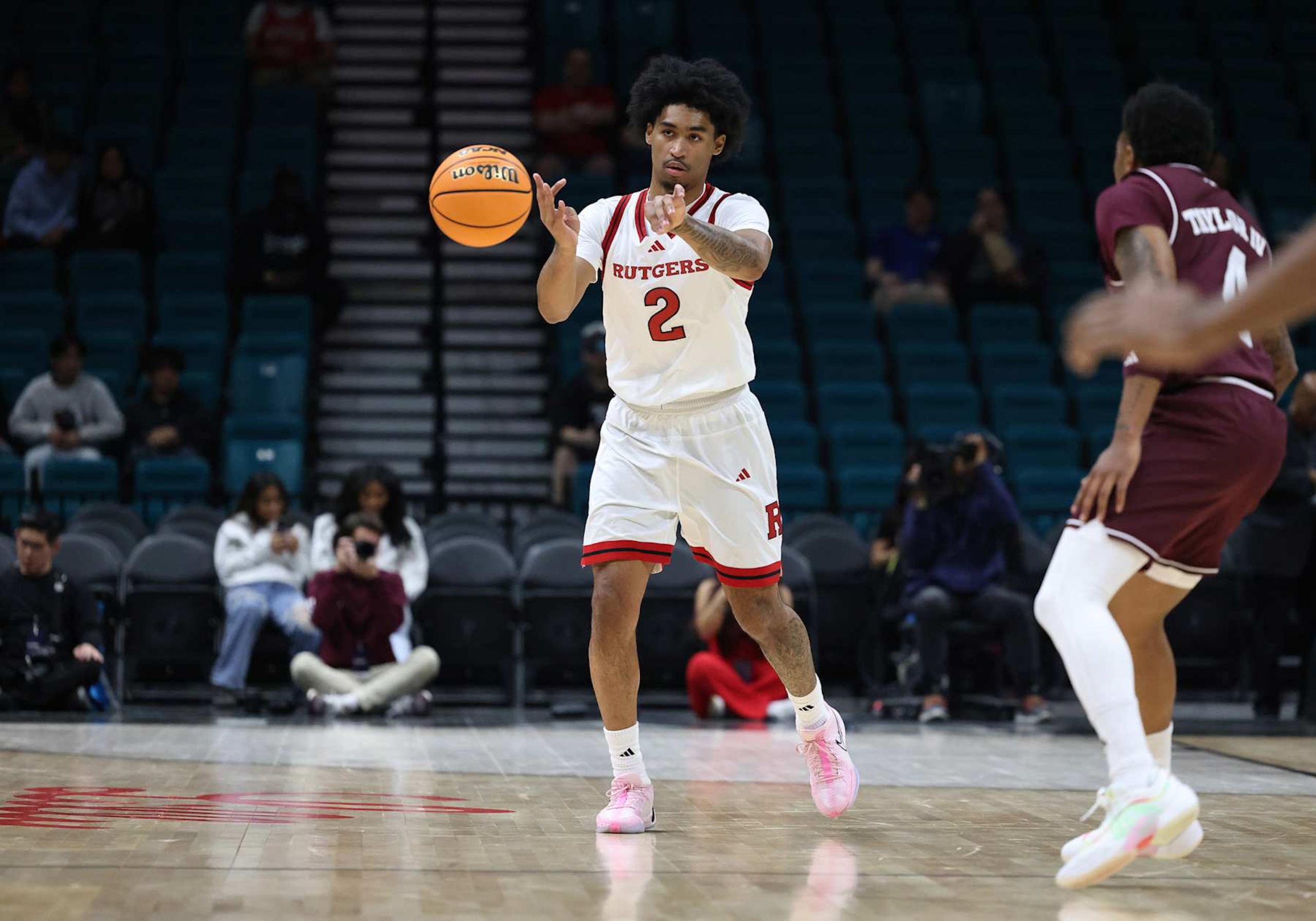 LAS VEGAS, NV - NOVEMBER 30: Rutgers Scarlet Knights guard Dylan Harper (2) passes the ball during a game against the Texas A&M Aggies at the Players Era Festival on Saturday, Nov. 30, 2024, at the MGM Grand Garden Arena in Las Vegas, Nevada. (Photo by Marc Sanchez/Icon Sportswire via Getty Images)