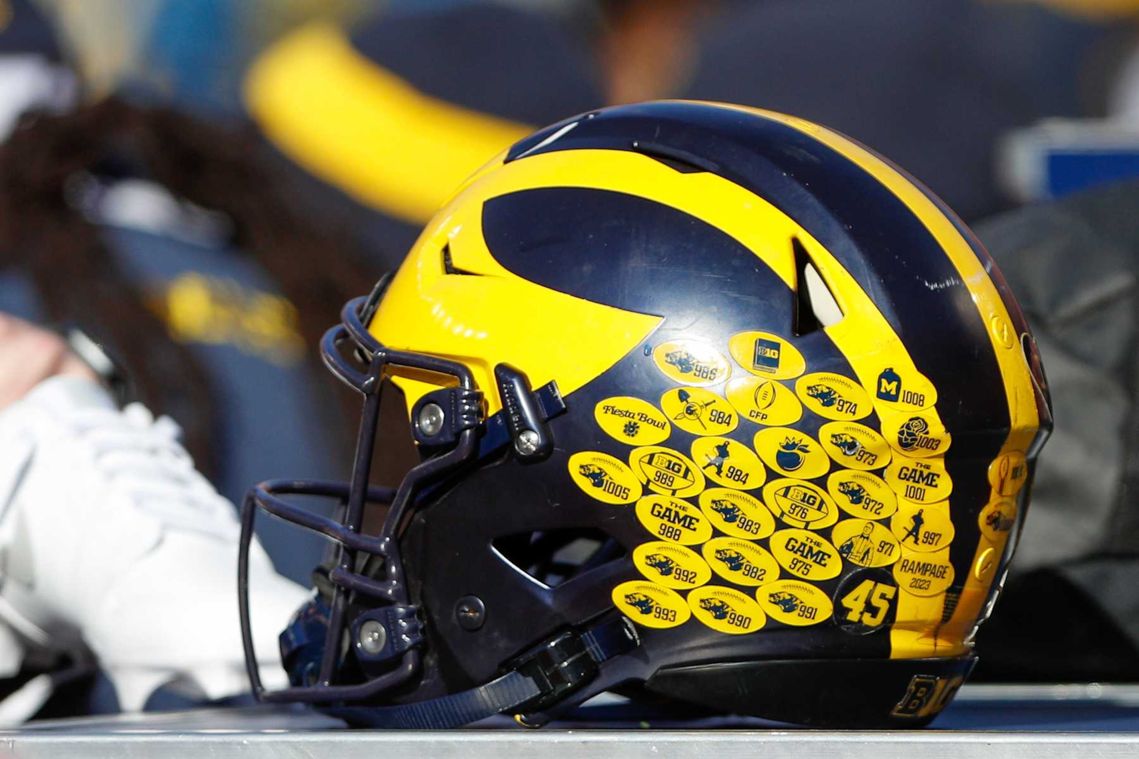COLUMBUS, OH - NOVEMBER 30: A Michigan Wolverines helmet sits before the game against the Michigan Wolverines and the Ohio State Buckeyes on November 30, 2024, at Ohio Stadium in Columbus, OH. (Photo by Ian Johnson/Icon Sportswire via Getty Images) COLUMBUS, OH - NOVEMBER 30: A Michigan Wolverines helmet sits before the game against the Michigan Wolverines and the Ohio State Buckeyes on November 30, 2024, at Ohio Stadium in Columbus, OH. (Photo by Ian Johnson/Icon Sportswire via Getty Images)