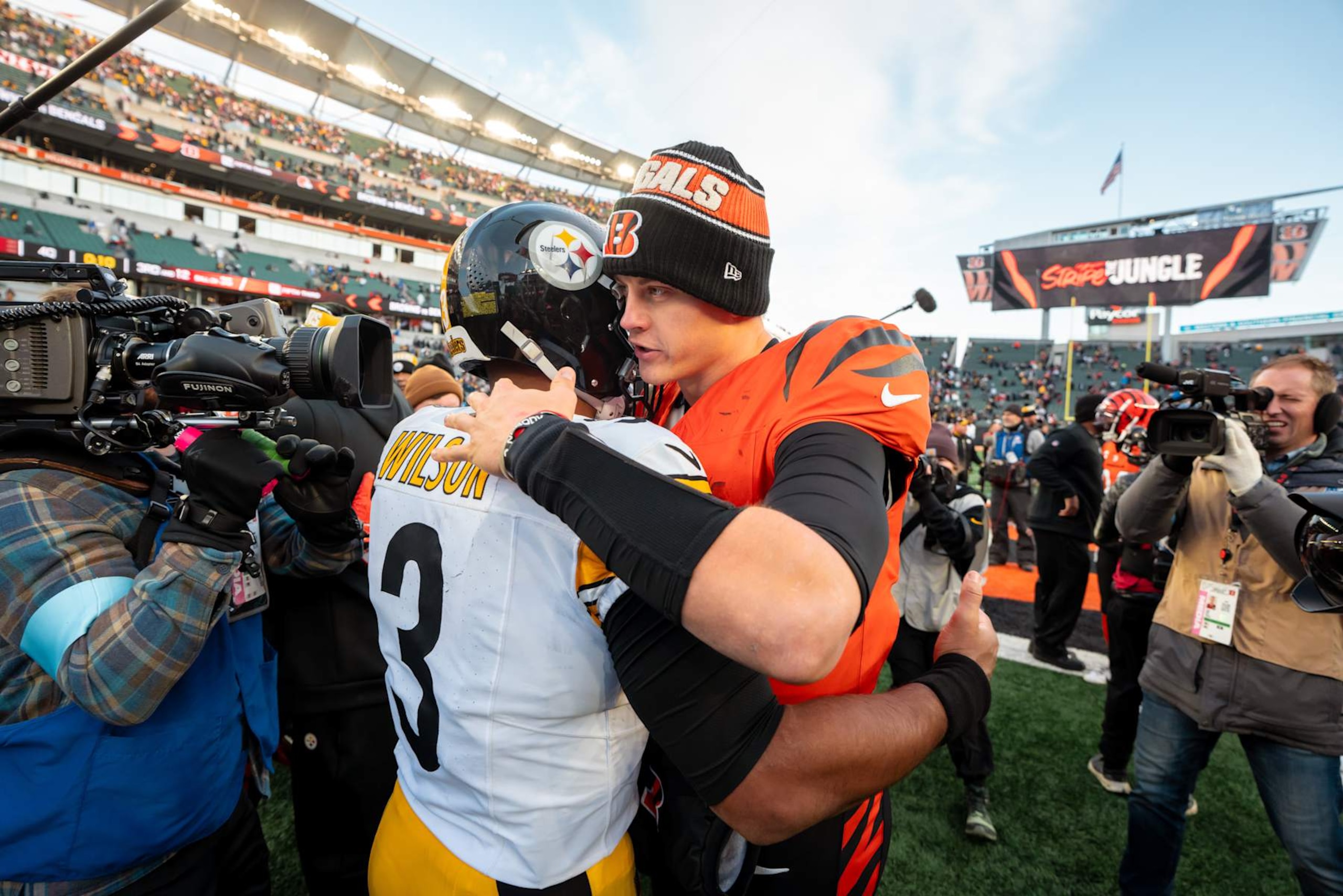 CINCINNATI, OHIO  - DECEMBER 1: Quarterback Russell Wilson #3 of the Pittsburgh Steelers and Quarterback Joe Burrow #9 of the Cincinnati Bengals meet following an NFL football game at Paycor Stadium on December 1, 2024 in Cincinnati, Ohio. (Photo by Todd Rosenberg/Getty Images)