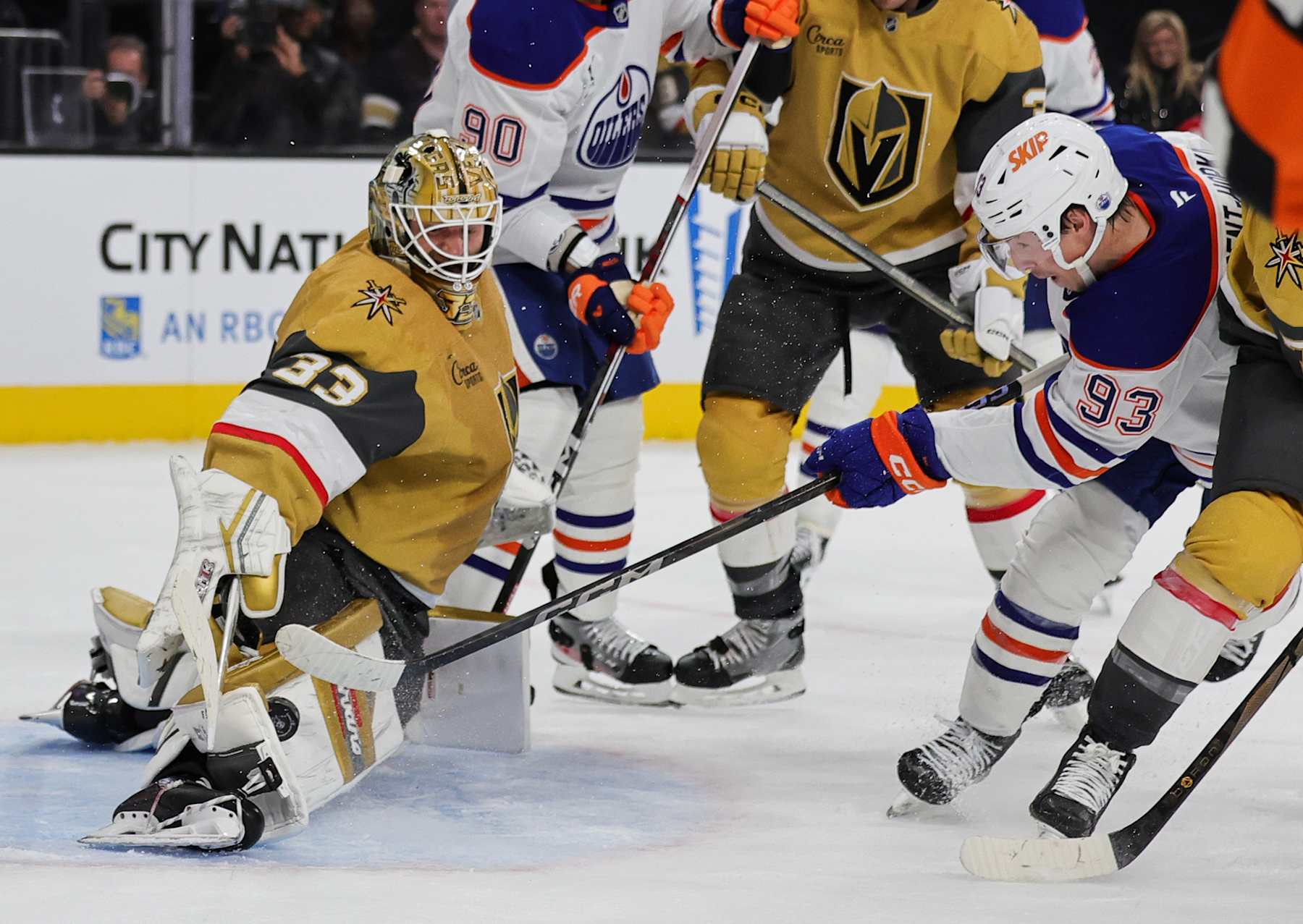 LAS VEGAS, NEVADA - DECEMBER 03: Adin Hill #33 of the Vegas Golden Knights blocks a shot by Ryan Nugent-Hopkins #93 of the Edmonton Oilers in the third period of their game at T-Mobile Arena on December 03, 2024 in Las Vegas, Nevada. The Golden Knights defeated the Oilers 1-0. (Photo by Ethan Miller/Getty Images)