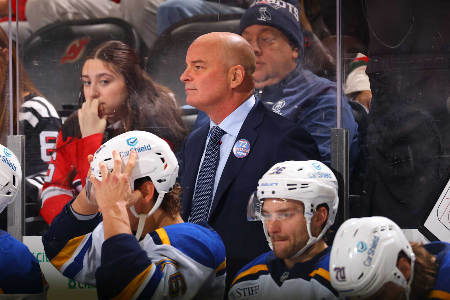 NEWARK, NJ - NOVEMBER 27: Jim Montgomery of the St. Louis Blues behind the bench in the first period of the game against the New Jersey Devils at the Prudential Center on November 27, 2024 in Newark, New Jersey. (Photo by Rich Graessle/NHLI via Getty Images)