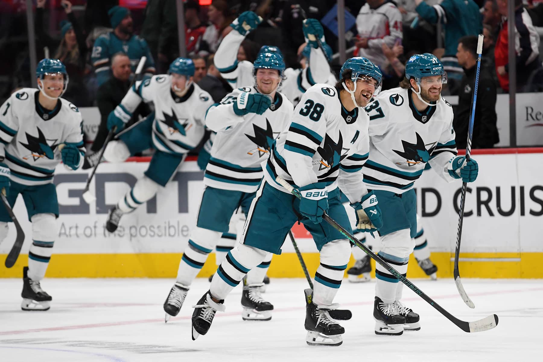 WASHINGTON, DC - DECEMBER 03: Sharks defensemen Mario Ferraro (38) and Timothy Liljegren (37) celebrate after the game-winning goal in overtime of the San Jose Sharks versus Washington Capitals National Hockey League game on December 3, 2024 at Capital One Arena in Washington, D.C.. (Photo by Randy Litzinger/Icon Sportswire via Getty Images)