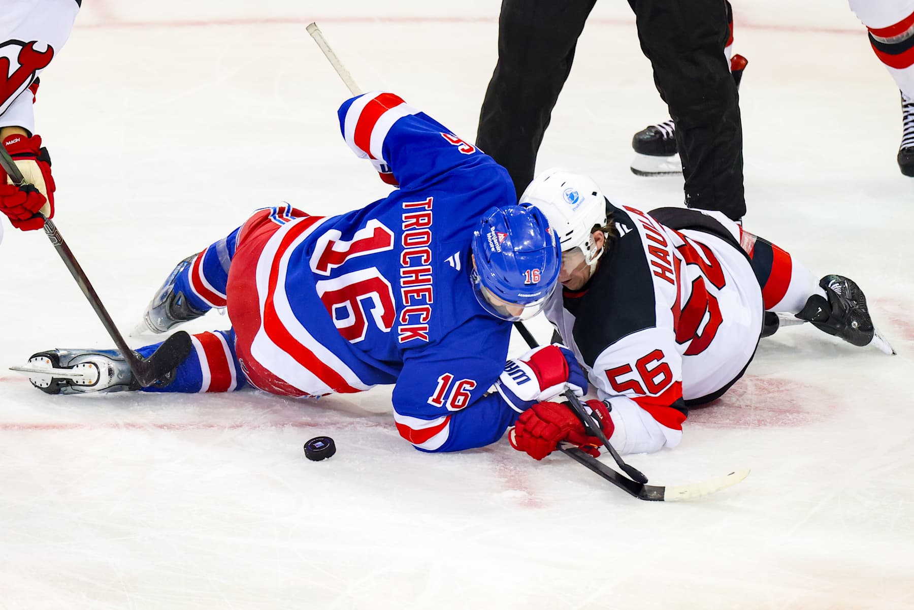 NEW YORK, NY - DECEMBER 02: New York Rangers Center Vincent Trocheck (16) and New Jersey Devils Center Erik Haula (56) face off during the third period of the National Hockey League game between the San Jose Sharks and the New York Rangers on November 29, 2024 at Madison Square Garden in New York, NY. (Photo by Joshua Sarner/Icon Sportswire via Getty Images)