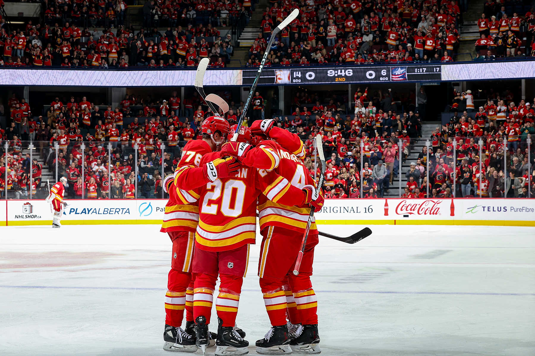 CALGARY, AB - DECEMBER 3: Rasmus Andersson #4 of the Calgary Flames celebrates with teammates after a goal against the Columbus Blue Jackets at Scotiabank Saddledome on December 3, 2024 in Calgary, Alberta, Canada. (Photo by Gerry Thomas/NHLI via Getty Images)